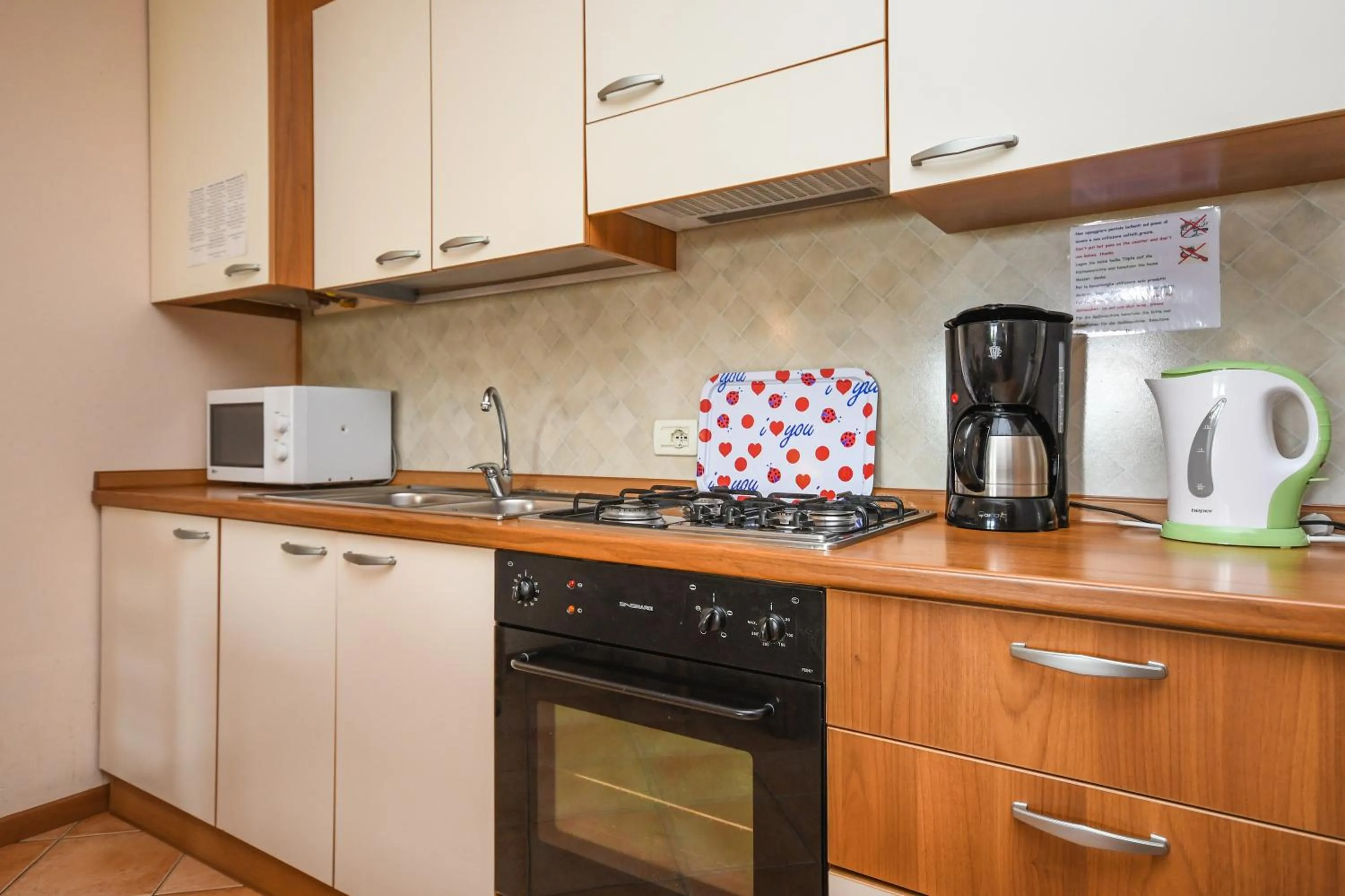 Kitchen or kitchenette in Residence Corte Ferrari -Ciao Vacanze-