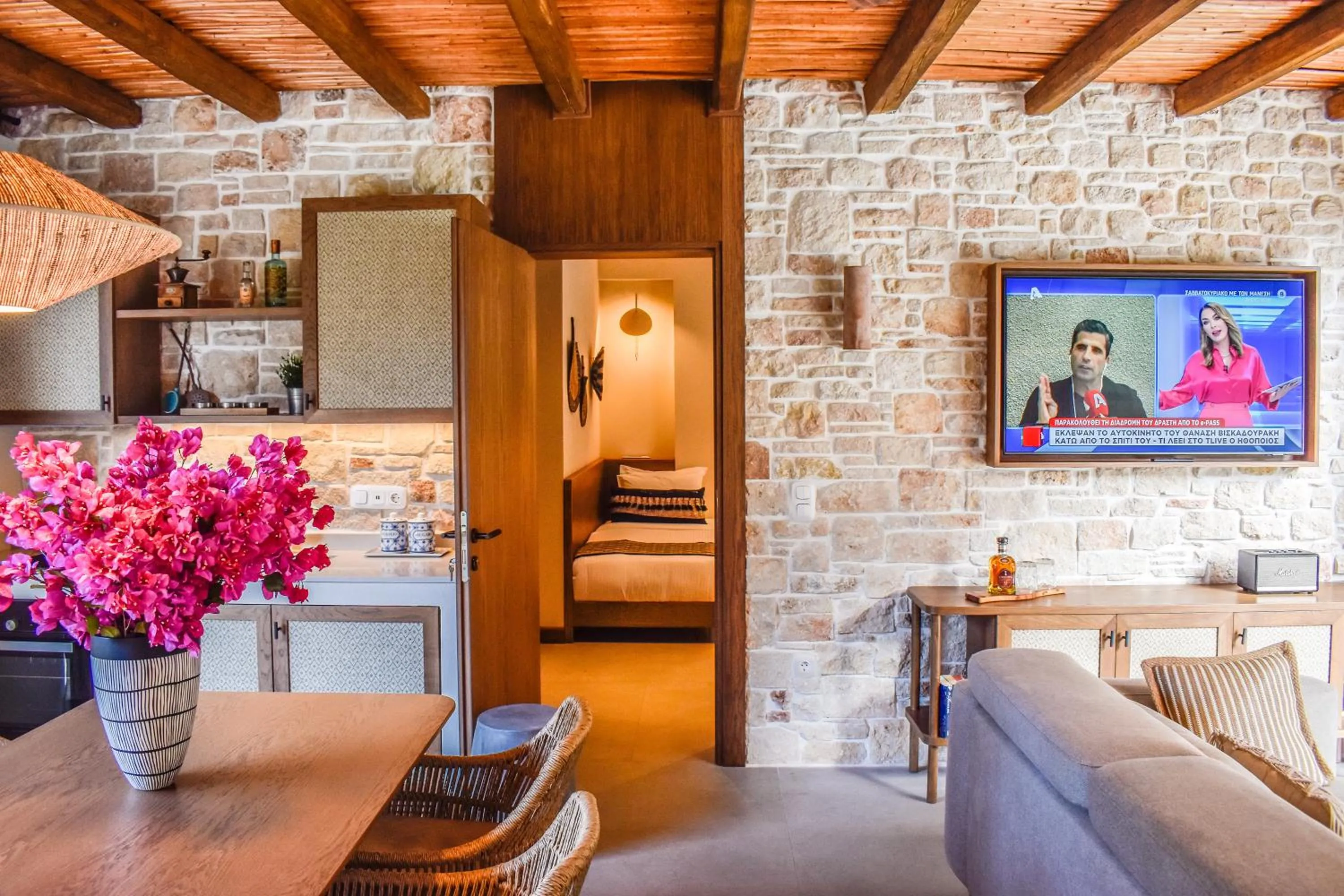 Communal lounge/ TV room in Mandraki Village Boutique Hotel