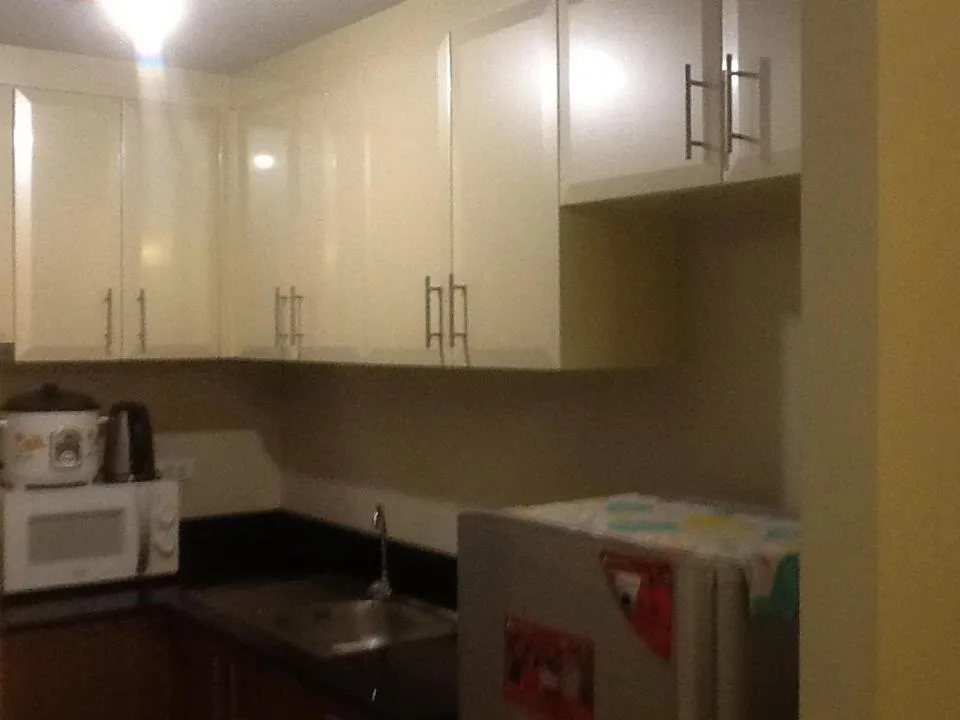 Kitchen or kitchenette in Palm Tree Genlex Condo