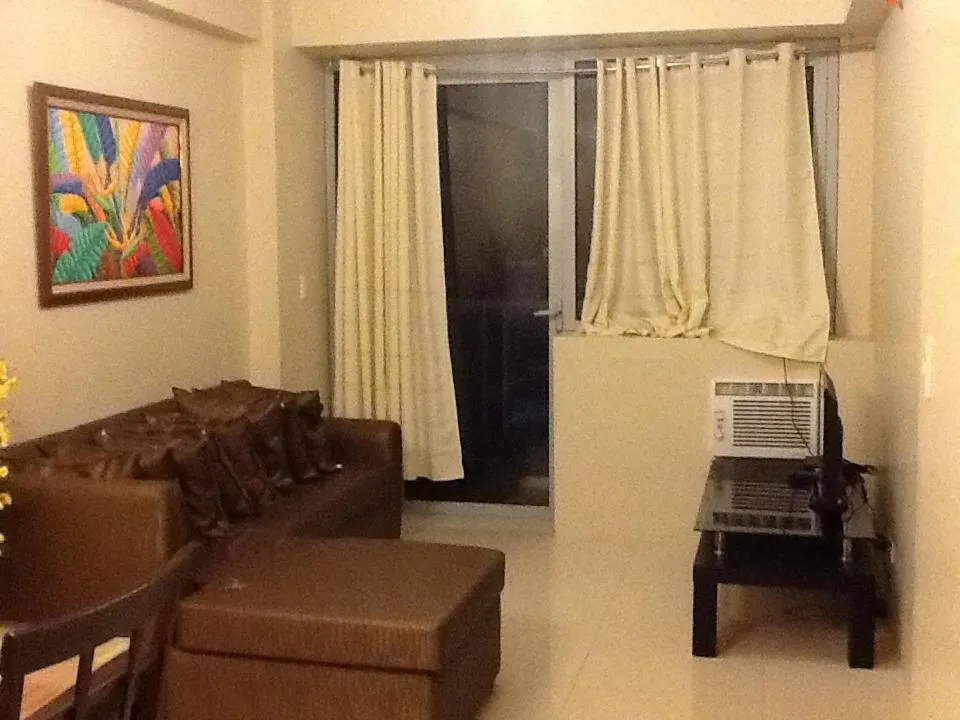 Living room in Palm Tree Genlex Condo