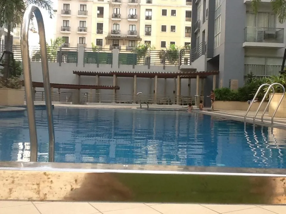 Swimming pool in Palm Tree Genlex Condo