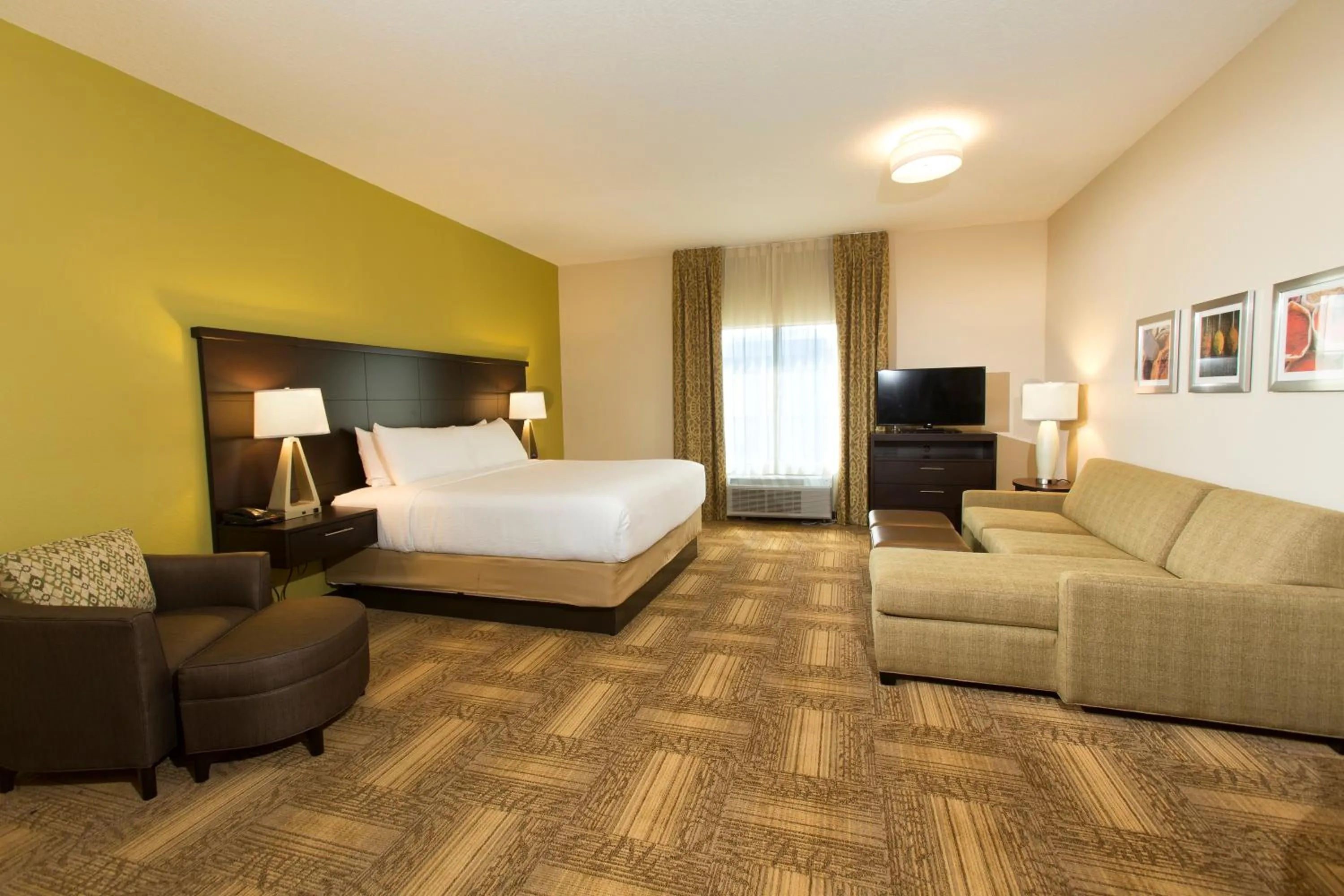 Photo of the whole room, Bed in Staybridge Suites Orlando at SeaWorld by IHG - Free Breakfast & Shuttle to SeaWorld Parks