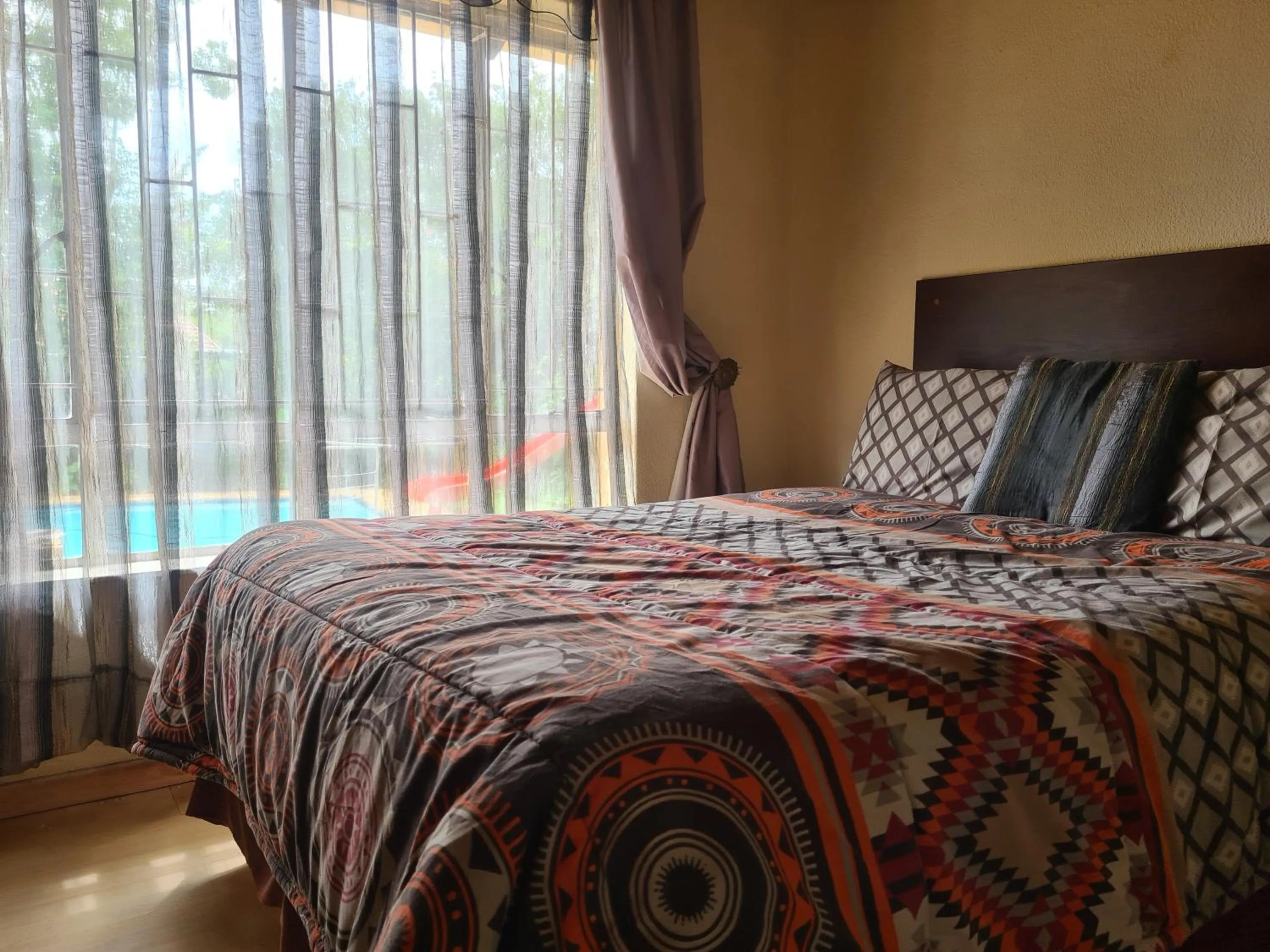 Bed in All Are Welcome Guest House