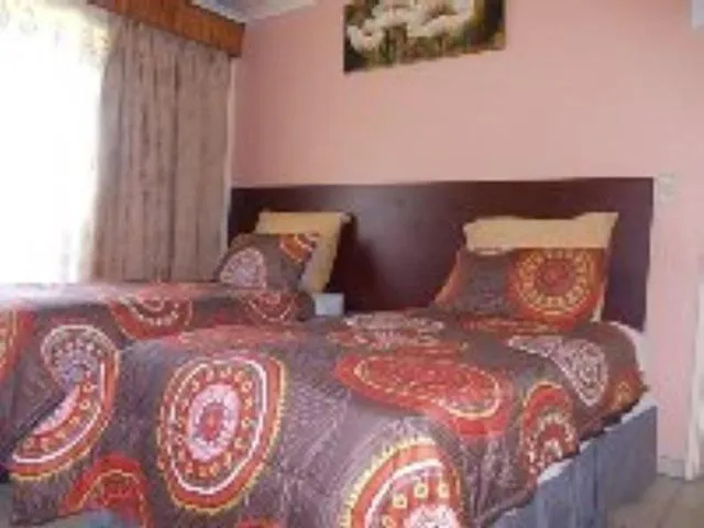 Bed in All Are Welcome Guest House