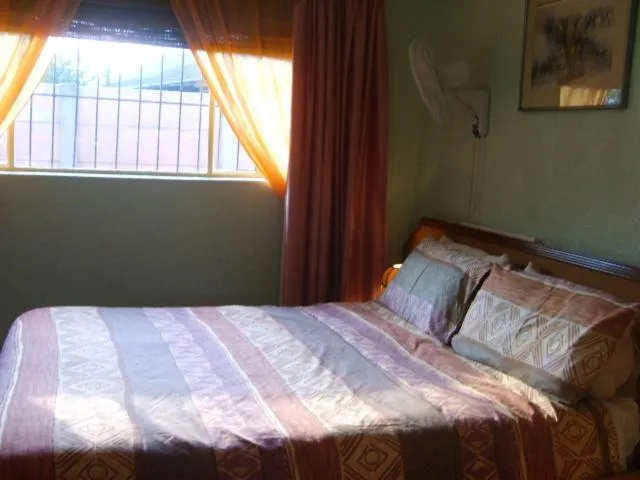 Bed in All Are Welcome Guest House