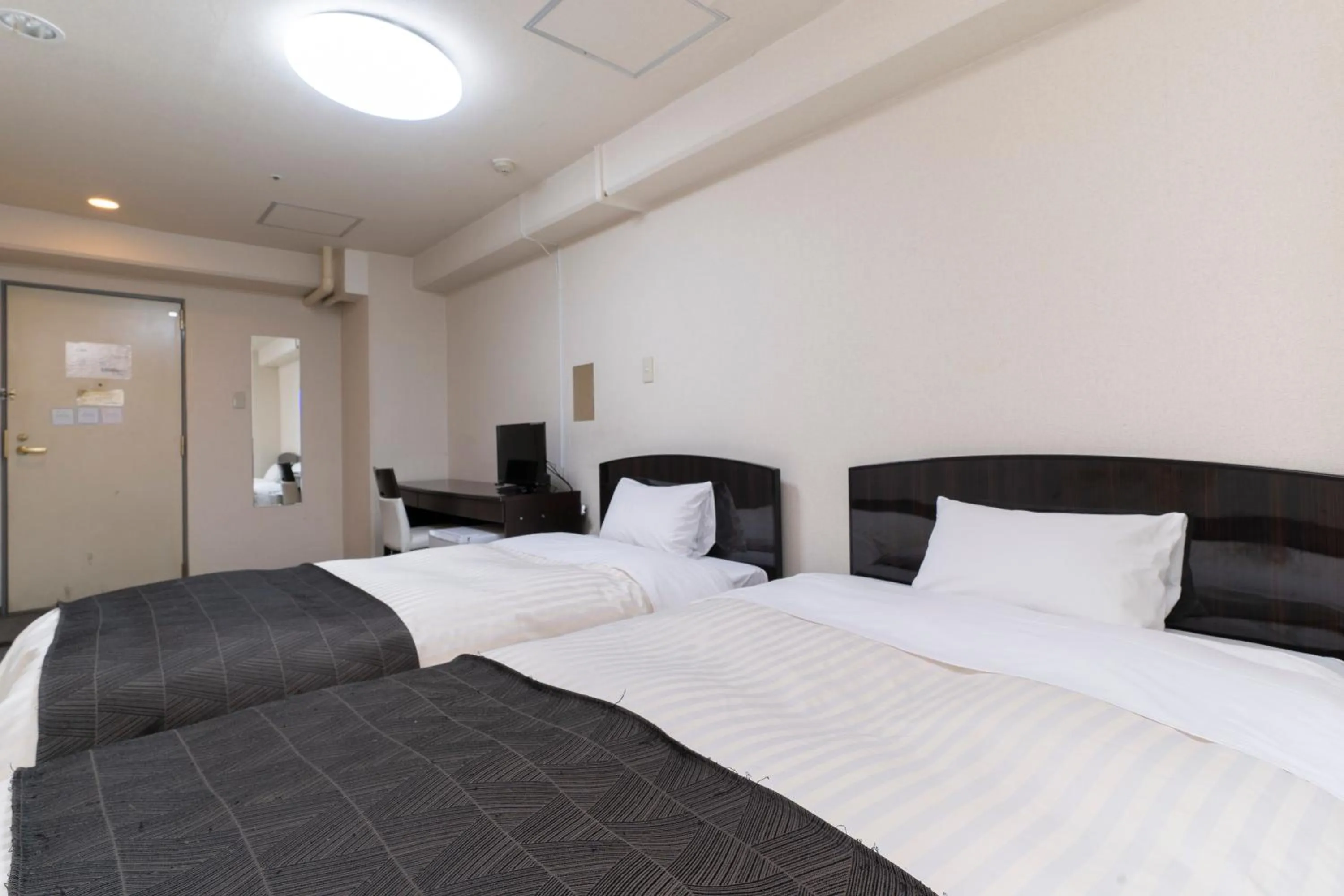 Photo of the whole room, Bed in HOTEL CITY INN WAKAYAMA Wakayama-Ekimae