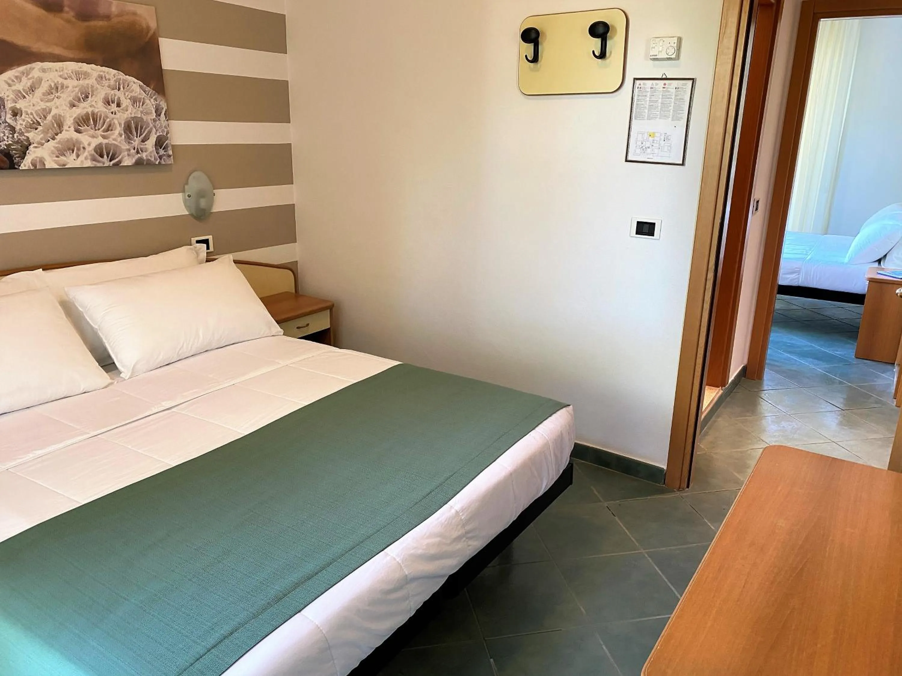 Photo of the whole room, Bed in Pinetina Mare Baby Family Hotel