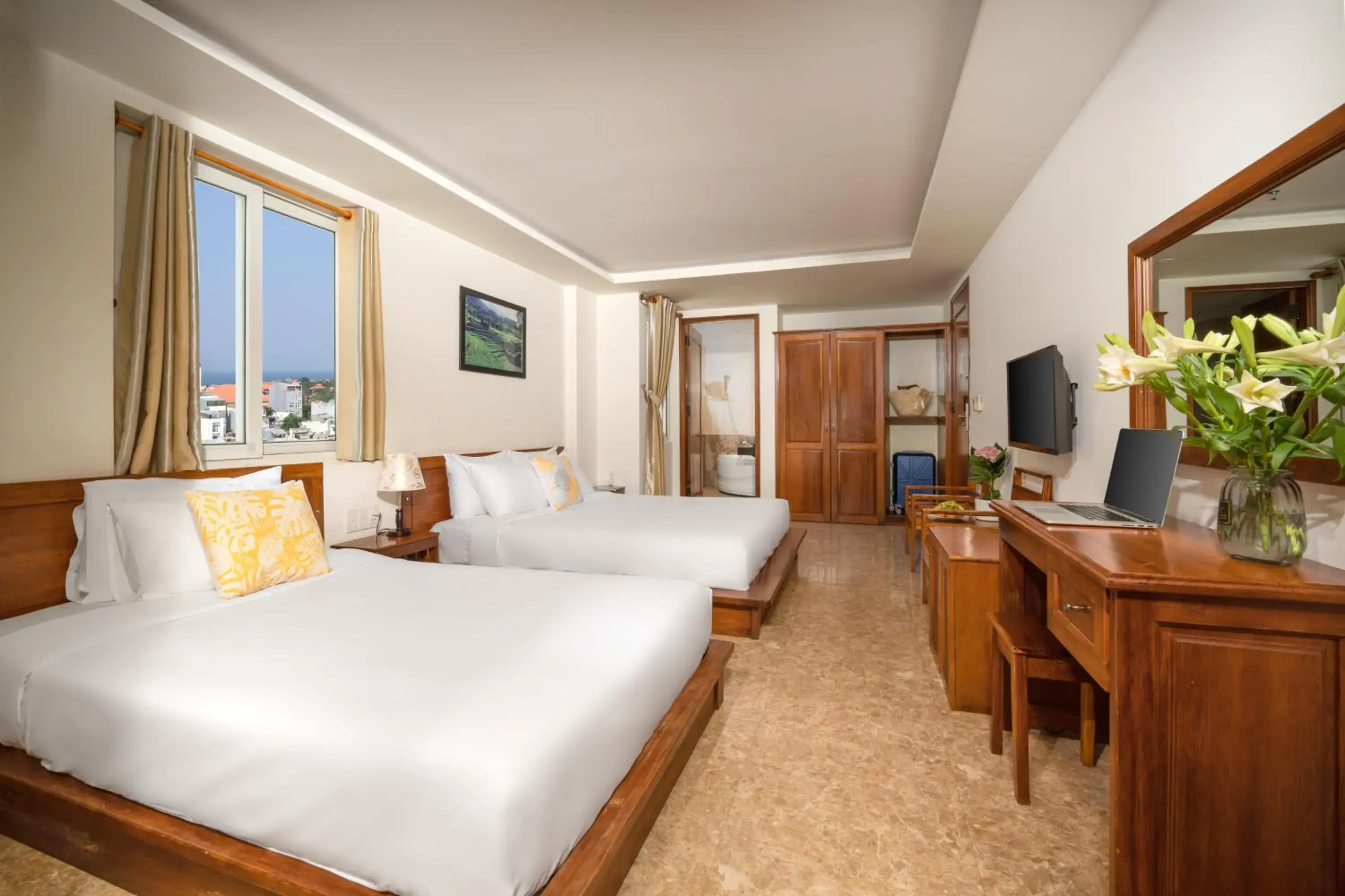 Deluxe Triple Room with City View in Titan Hotel Da Nang Deluxe Triple Room with City View in Titan Hotel Da Nang