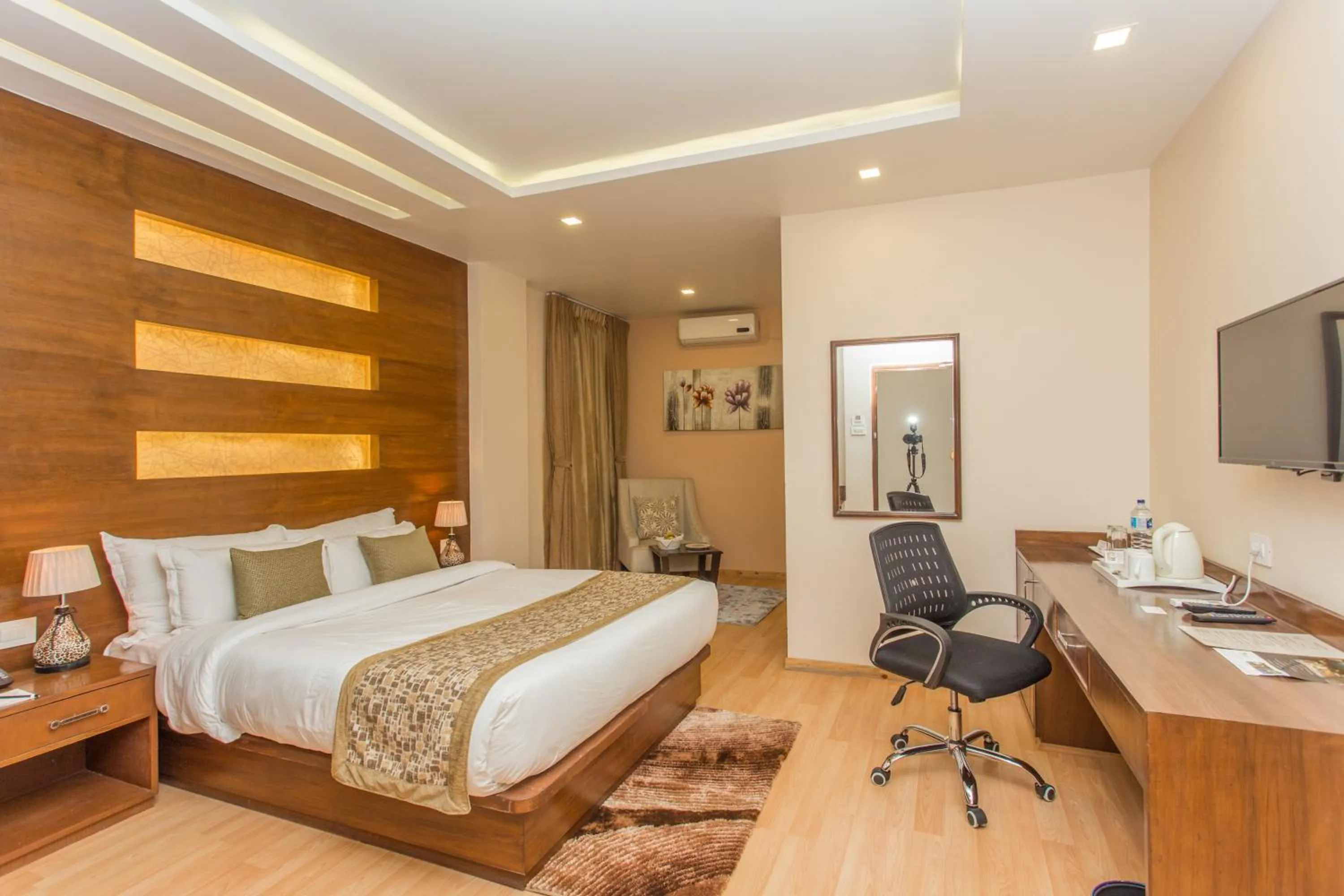 Bed in Yatri Suites and Spa
