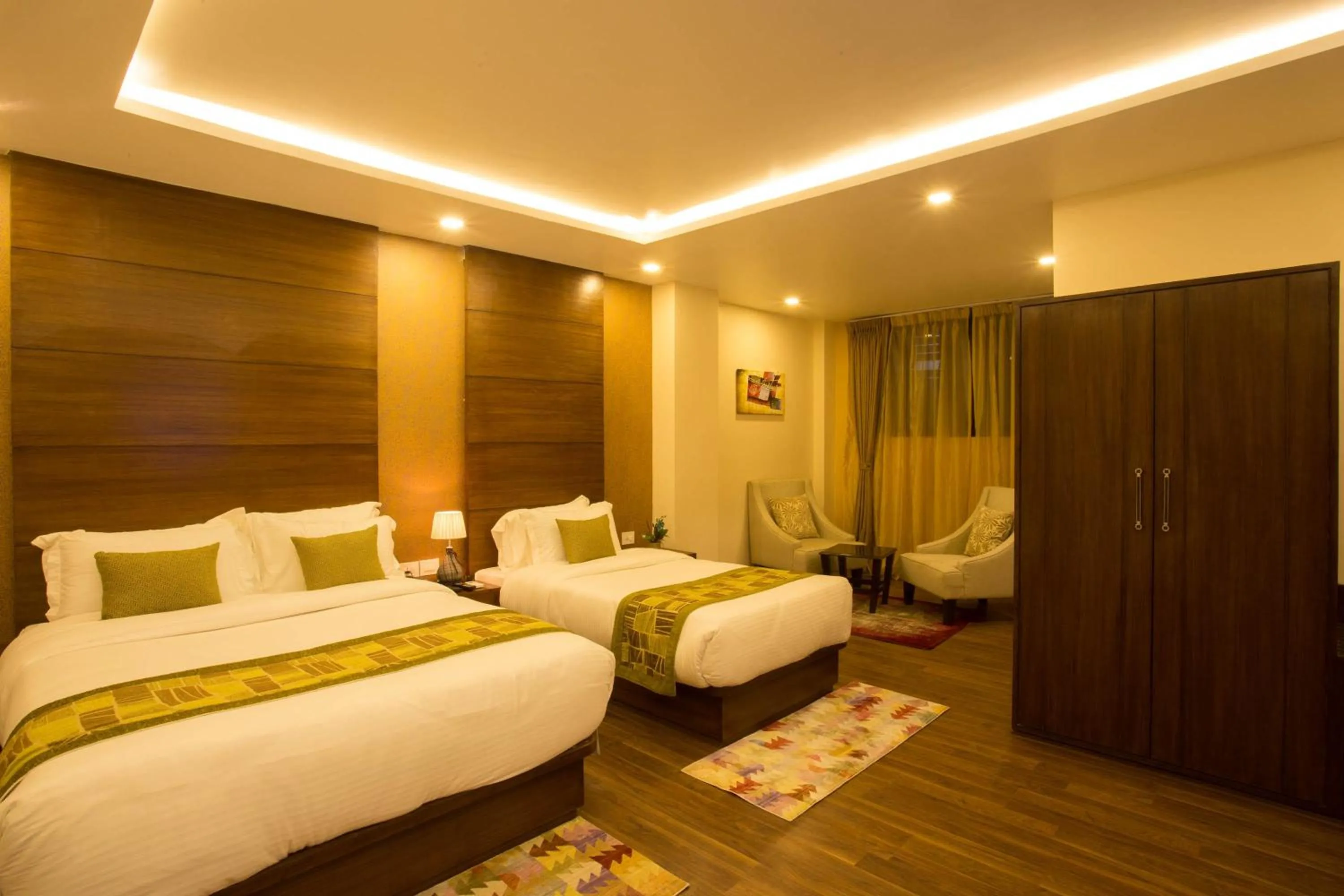 Bed in Yatri Suites and Spa