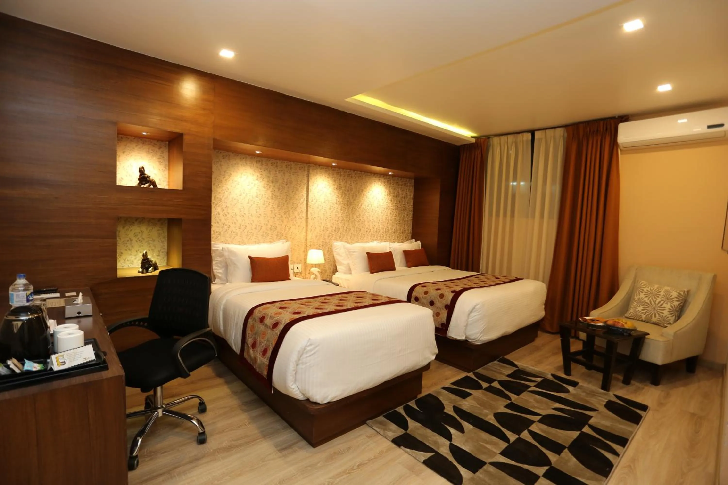 Bed in Yatri Suites and Spa