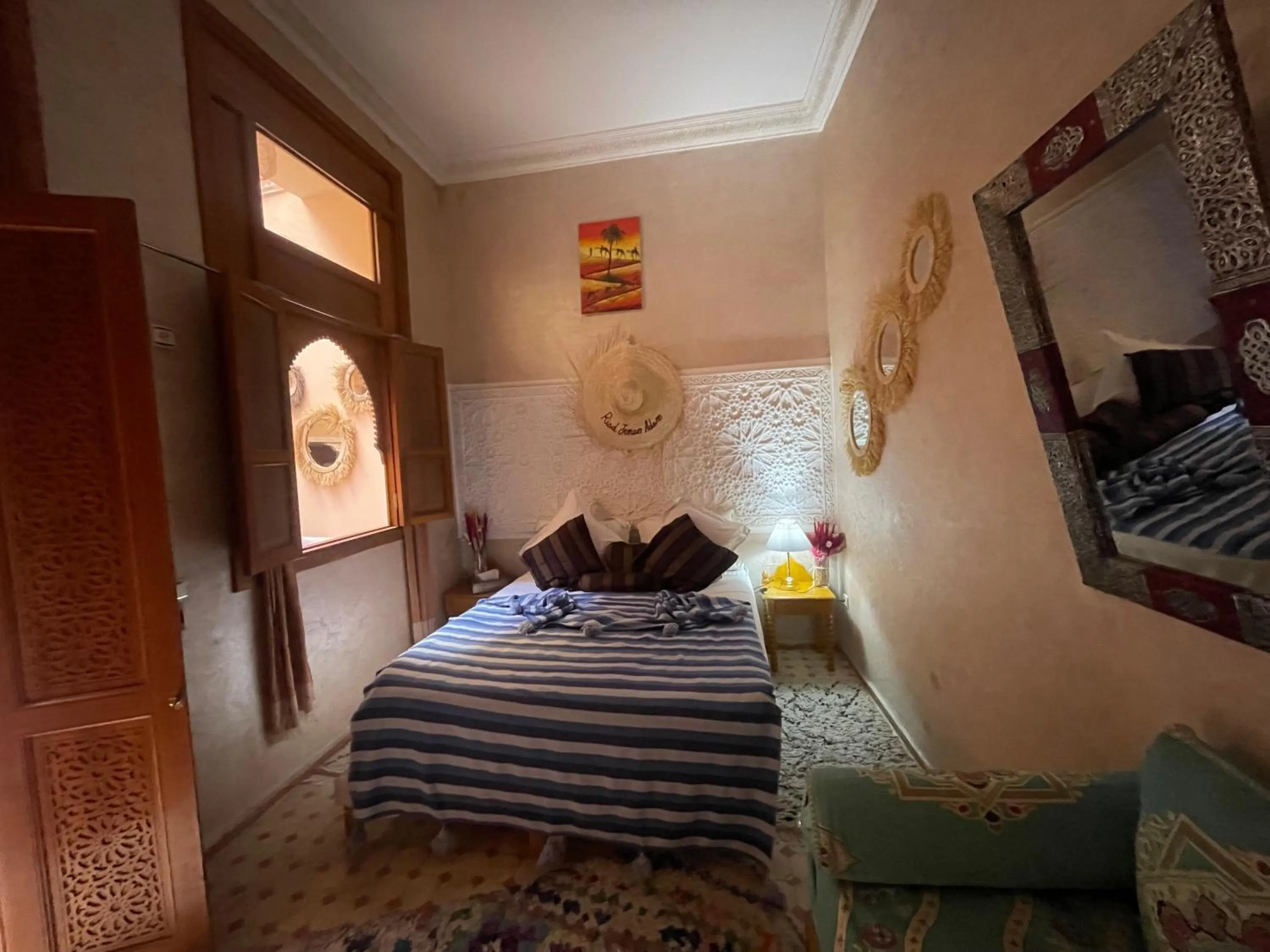 Bed in Riad Jenan Adam