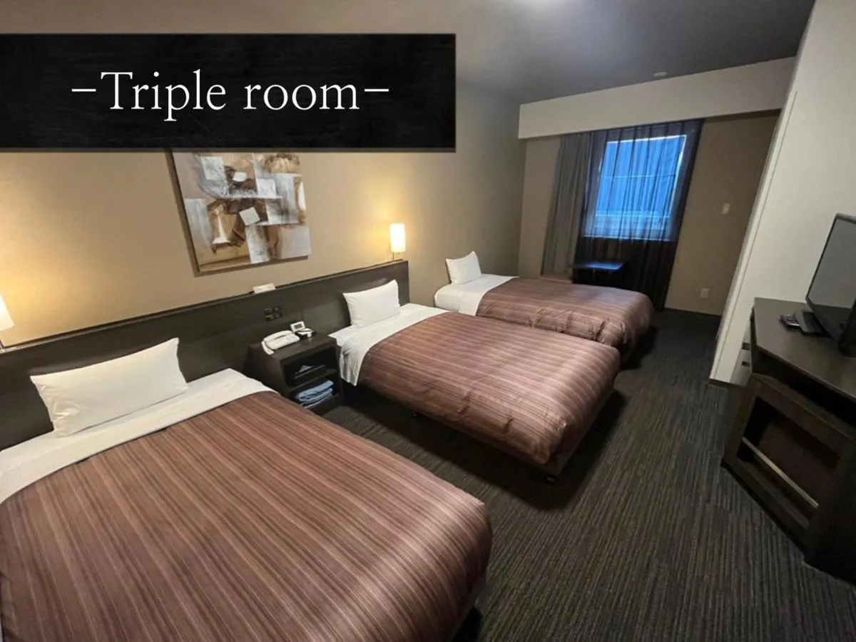 Bed in Hotel Route Inn Grand Asahikawa Ekimae