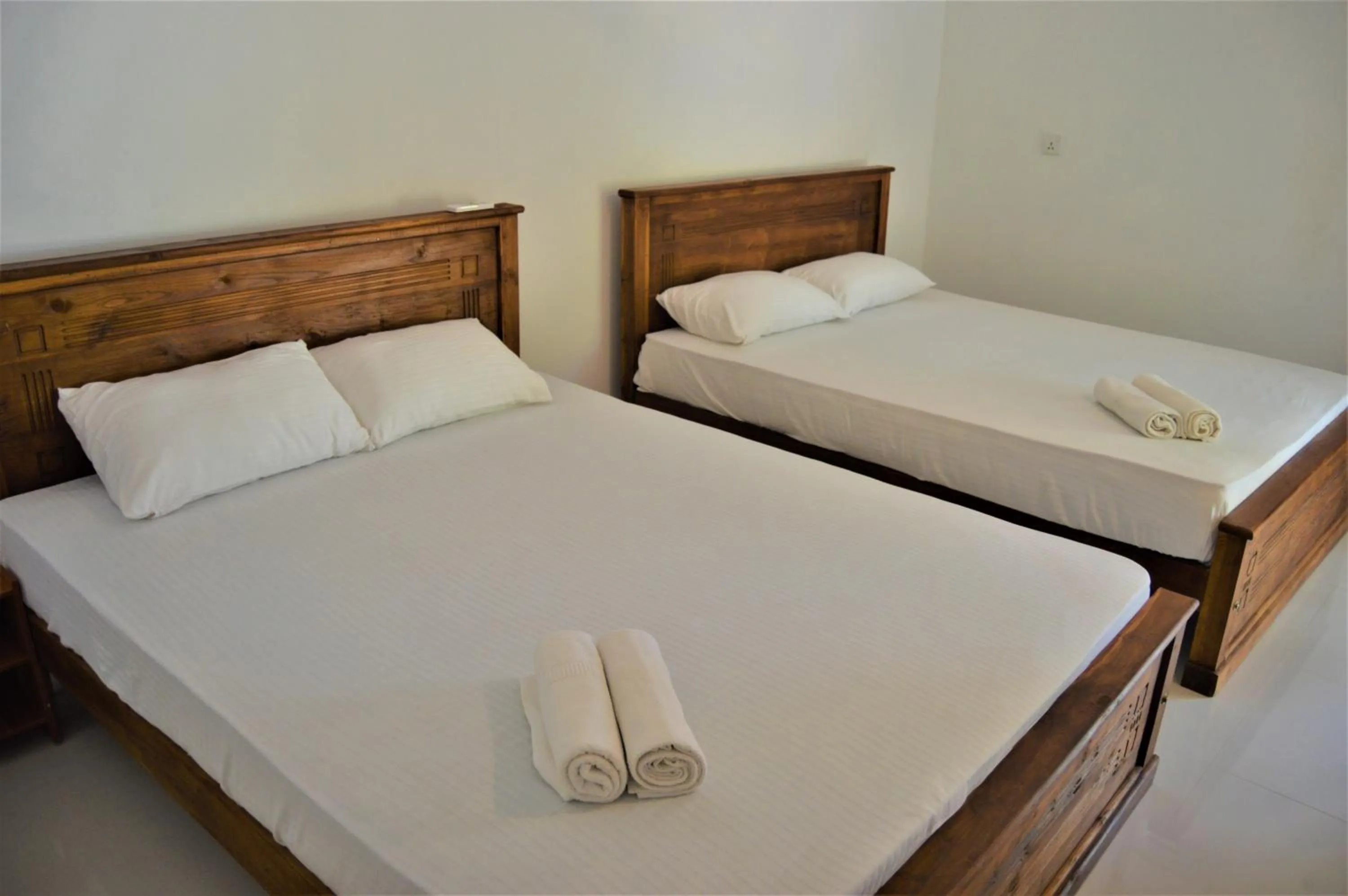 Bed in Shim Beach Resort