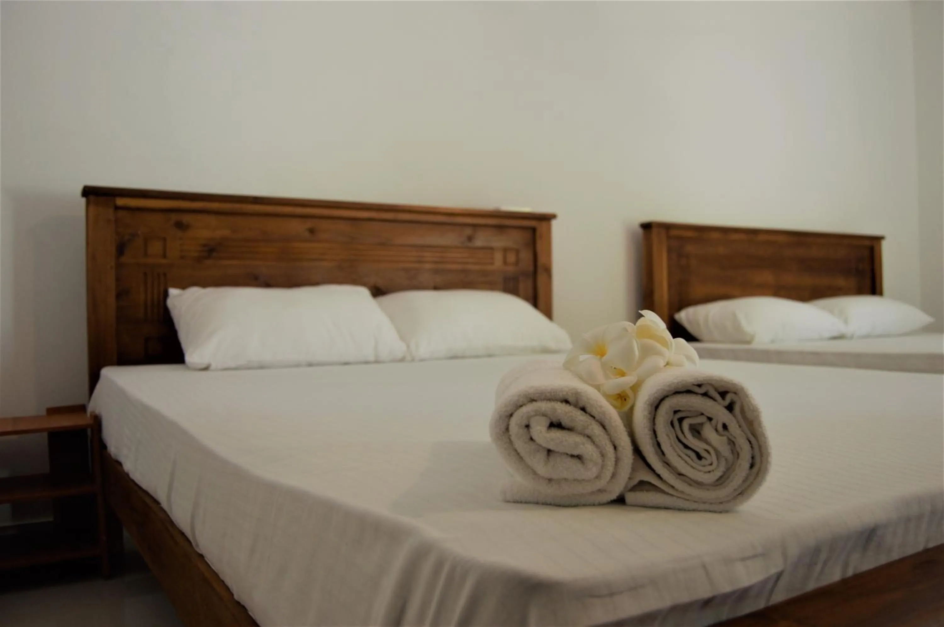 Bed in Shim Beach Resort