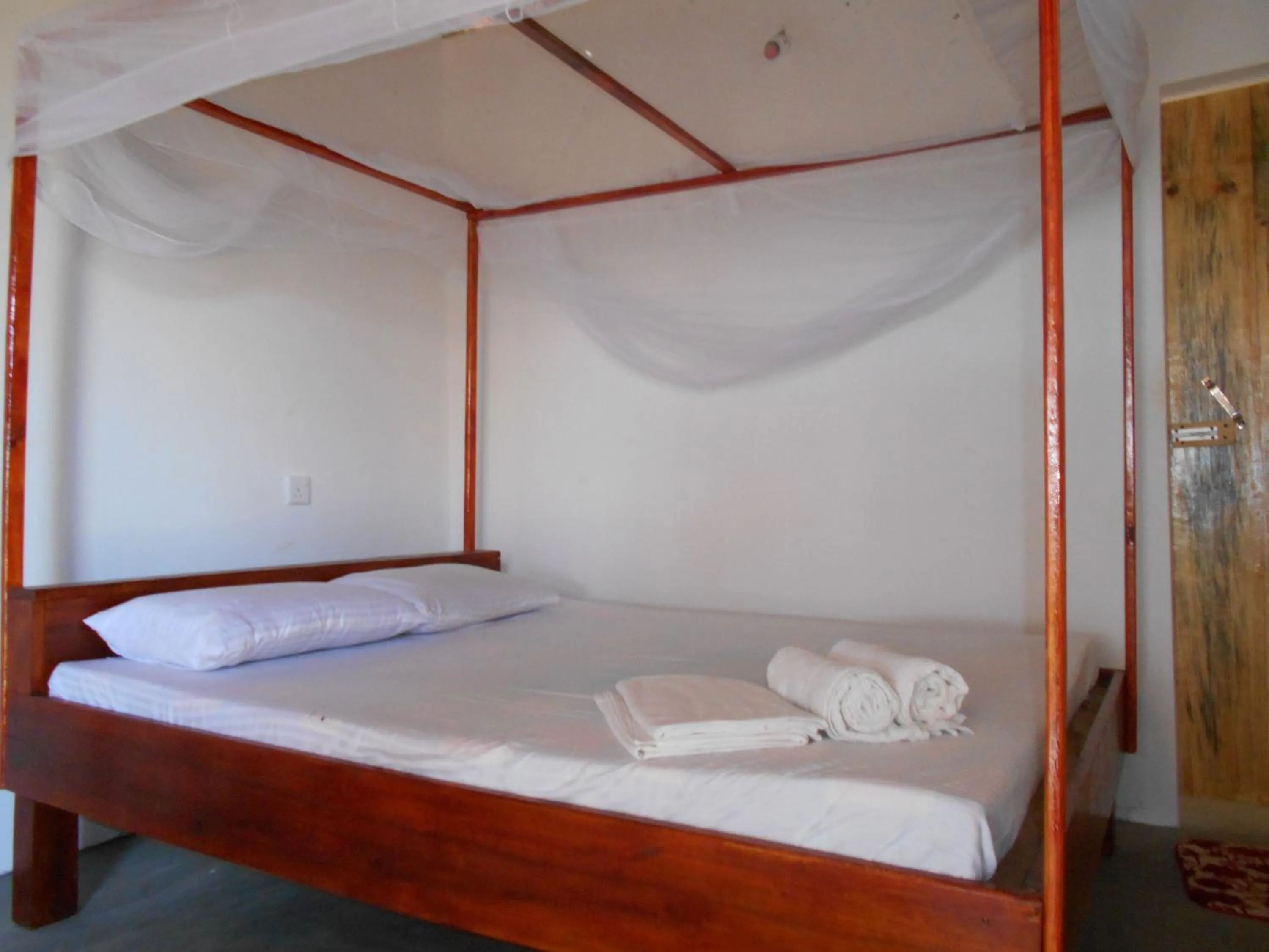 Bed in Shim Beach Resort