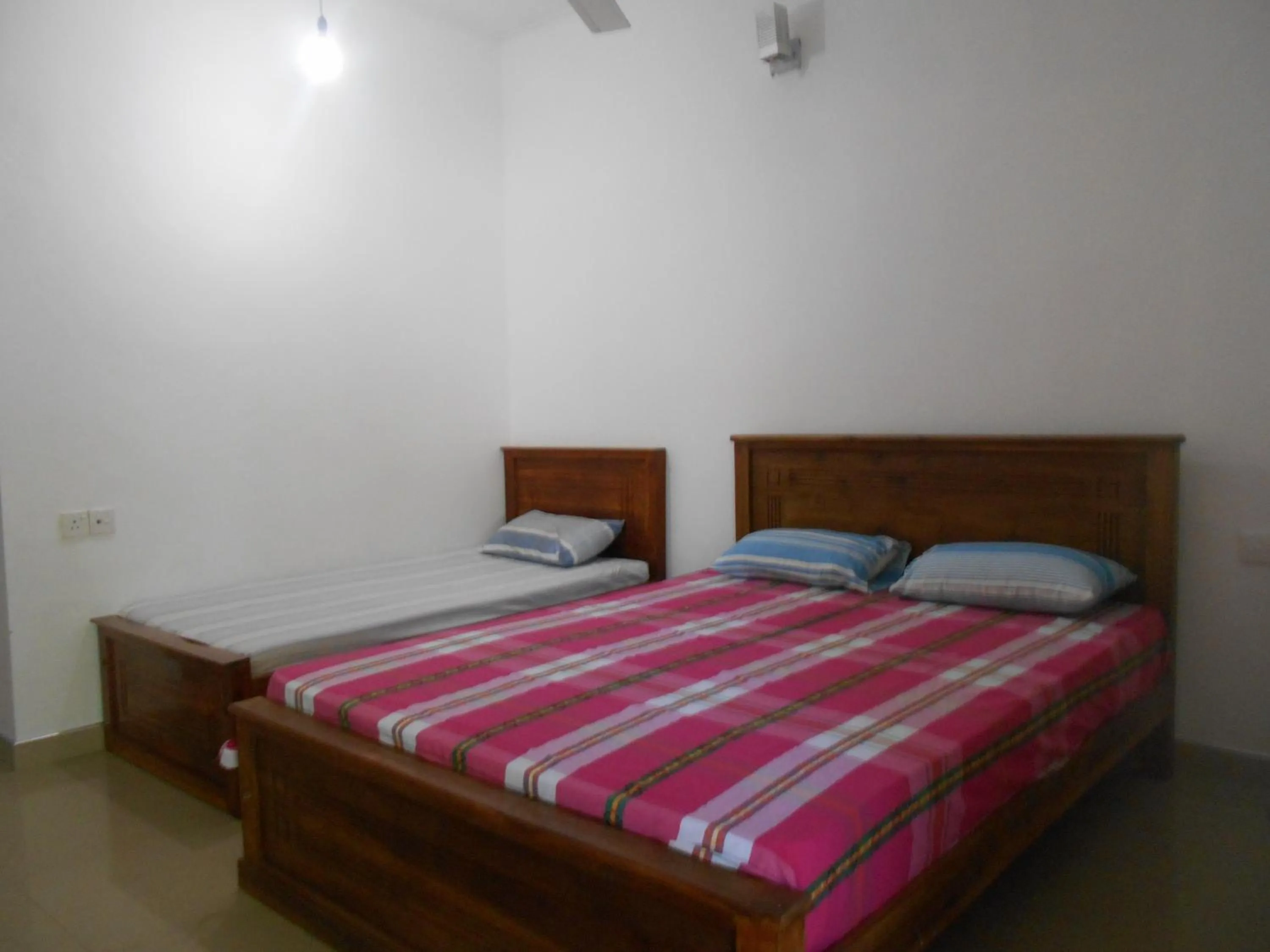 Bed in Shim Beach Resort