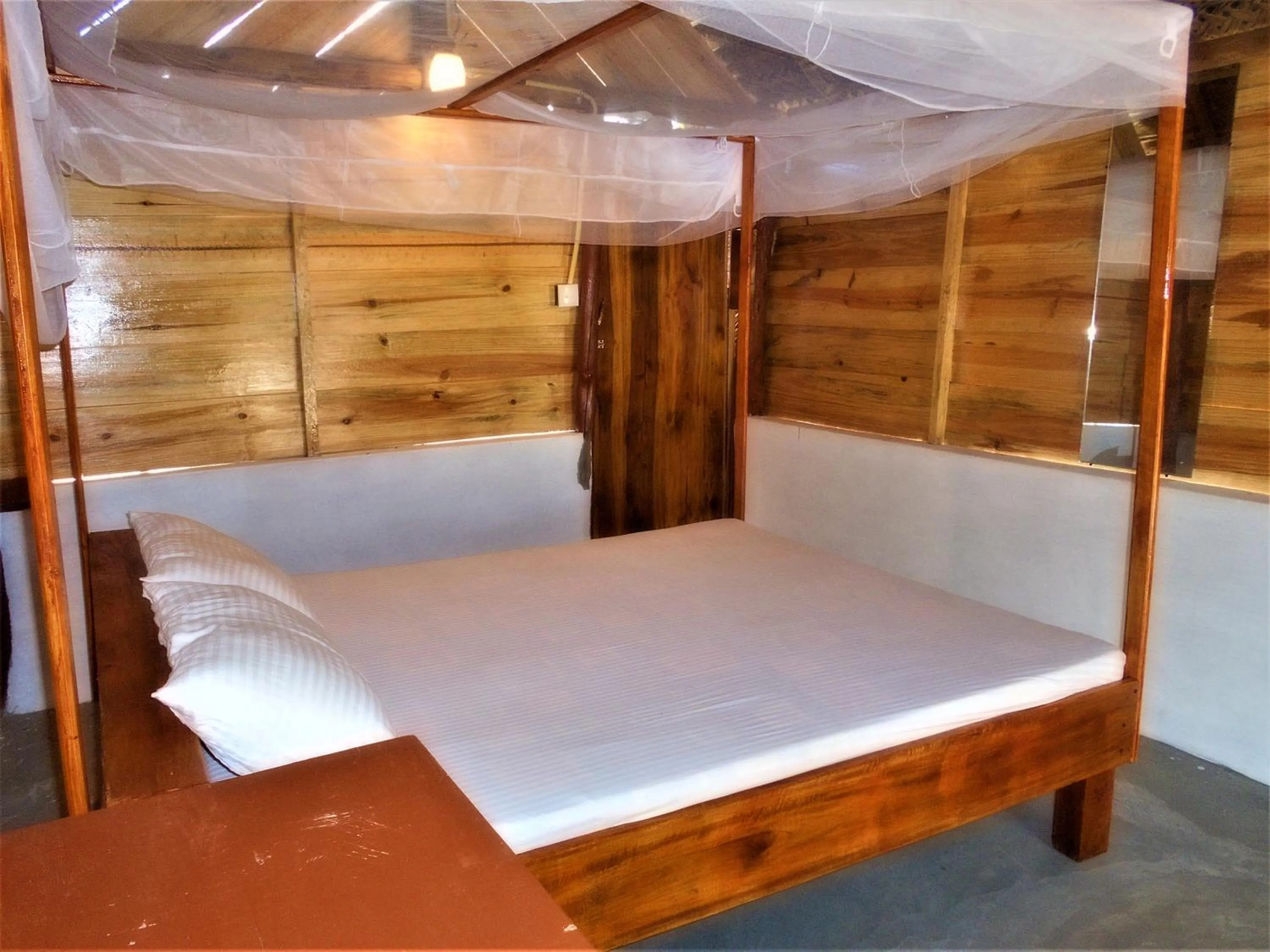 Bed in Shim Beach Resort