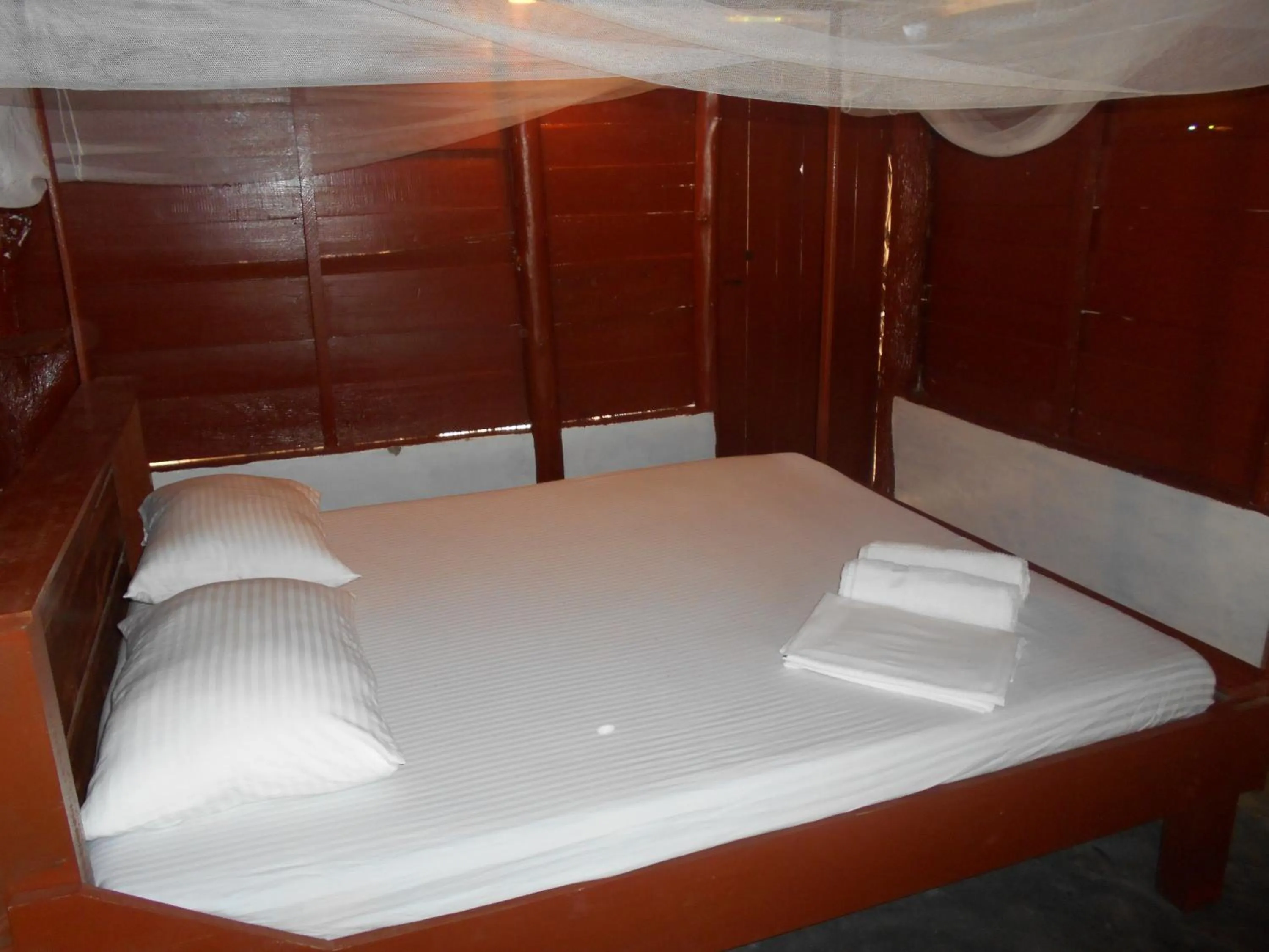 Bed in Shim Beach Resort