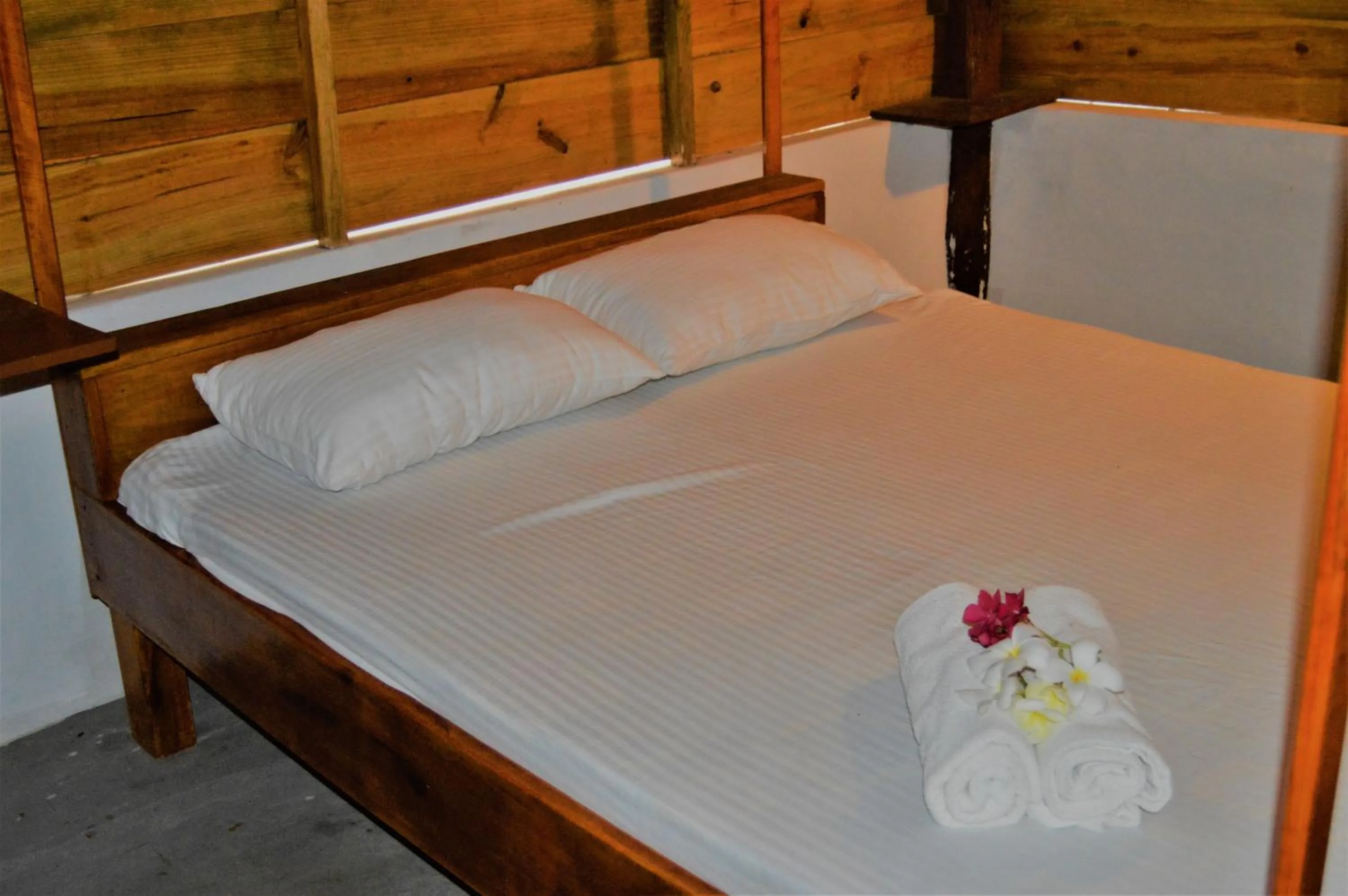 Bed in Shim Beach Resort