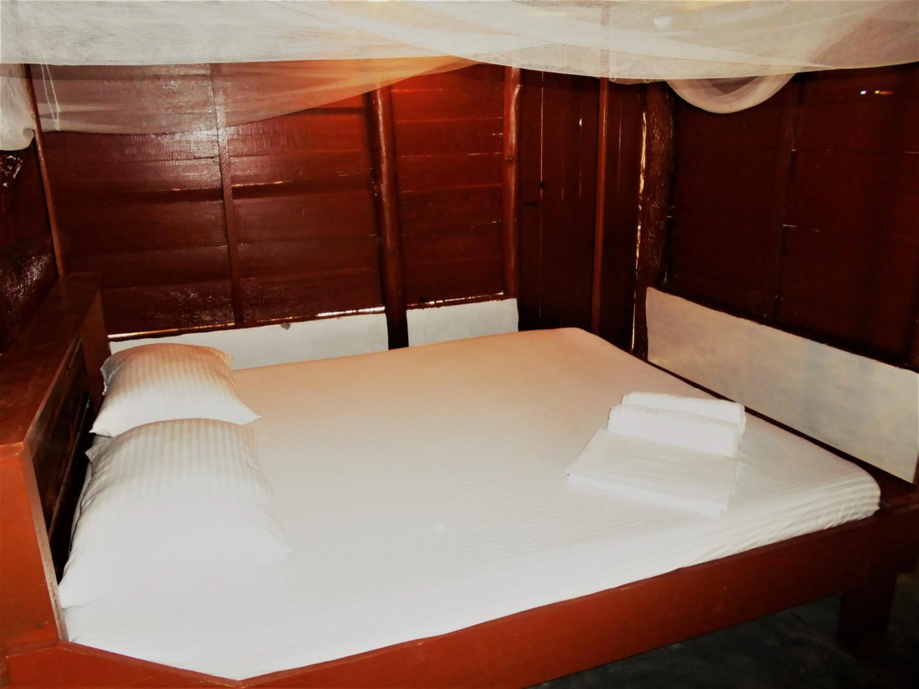 Bed in Shim Beach Resort