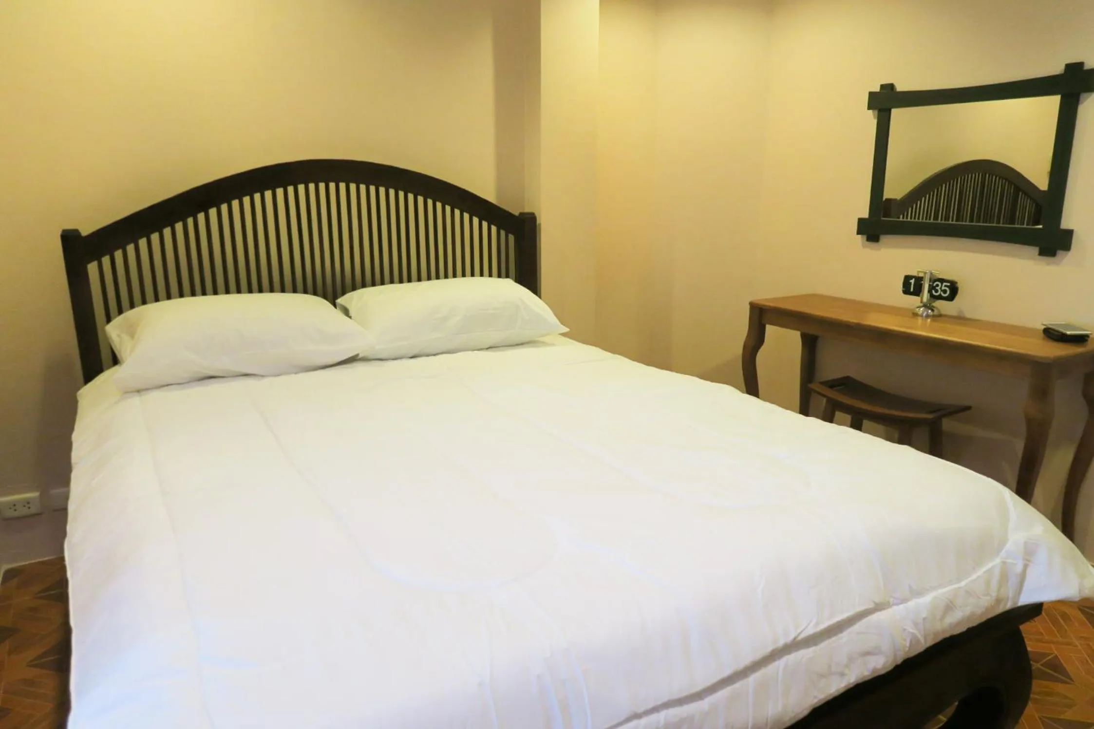 Bed in The Grand Palace Hotel