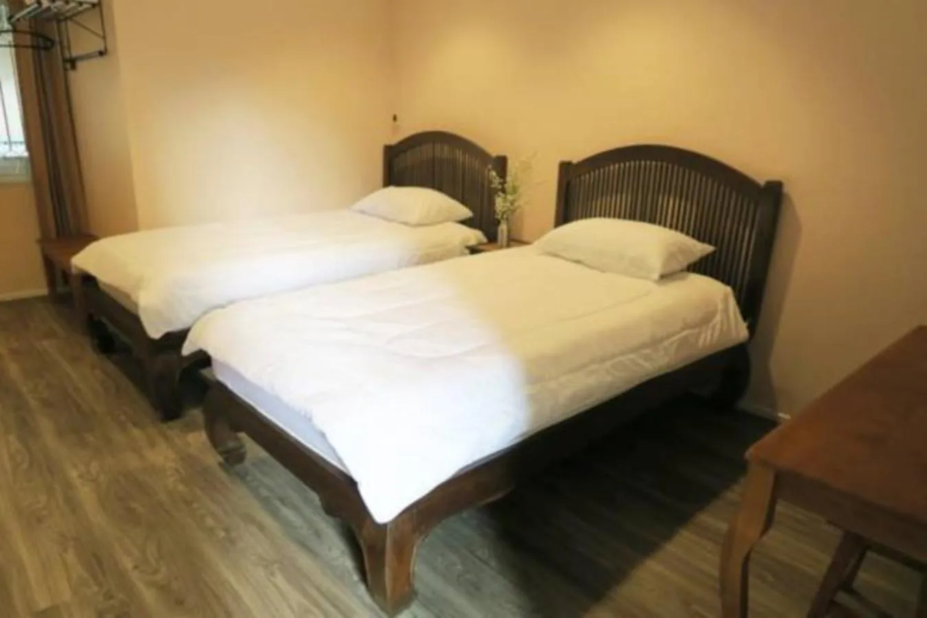 Bed in The Grand Palace Hotel