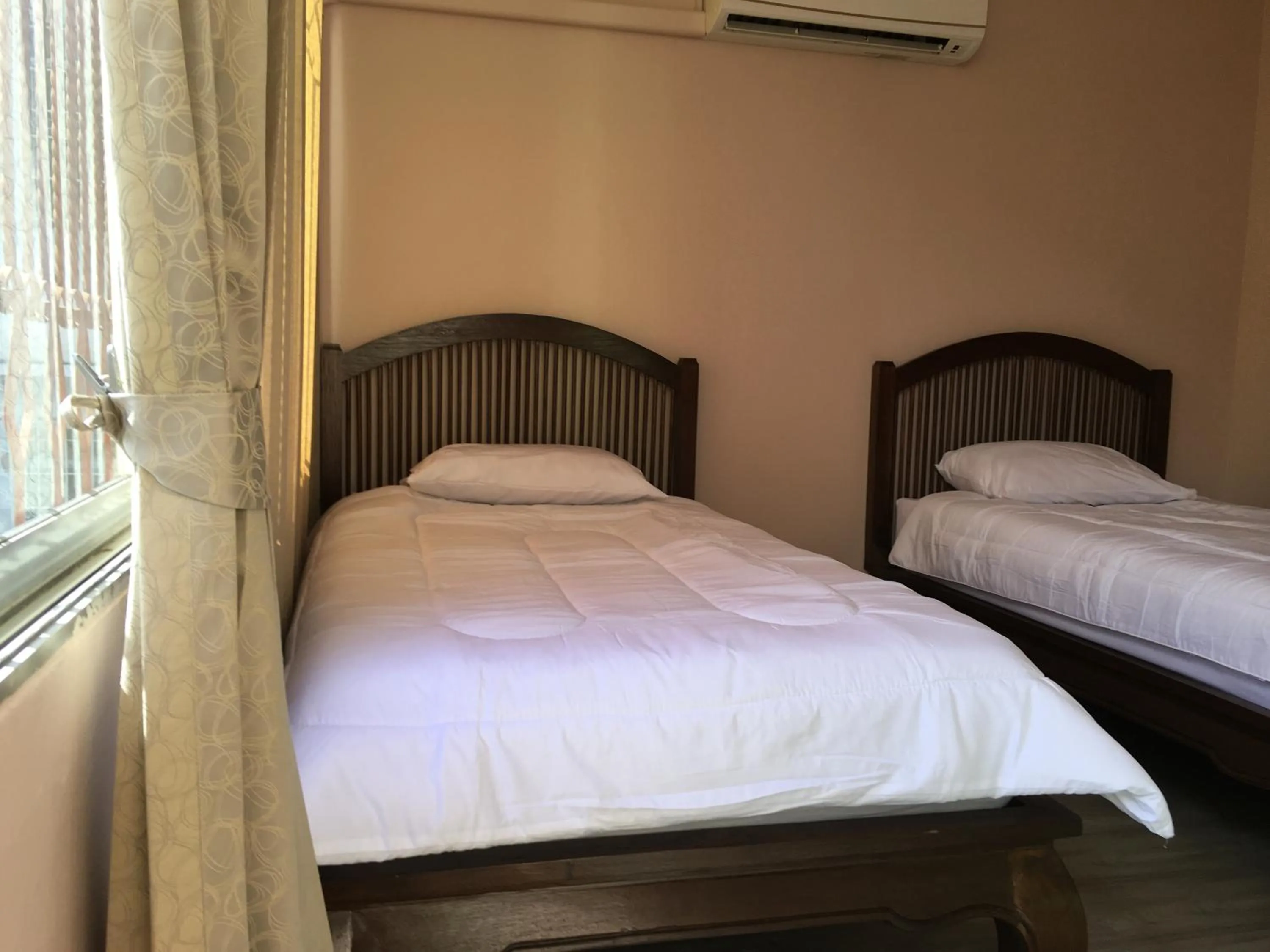 Bed in The Grand Palace Hotel