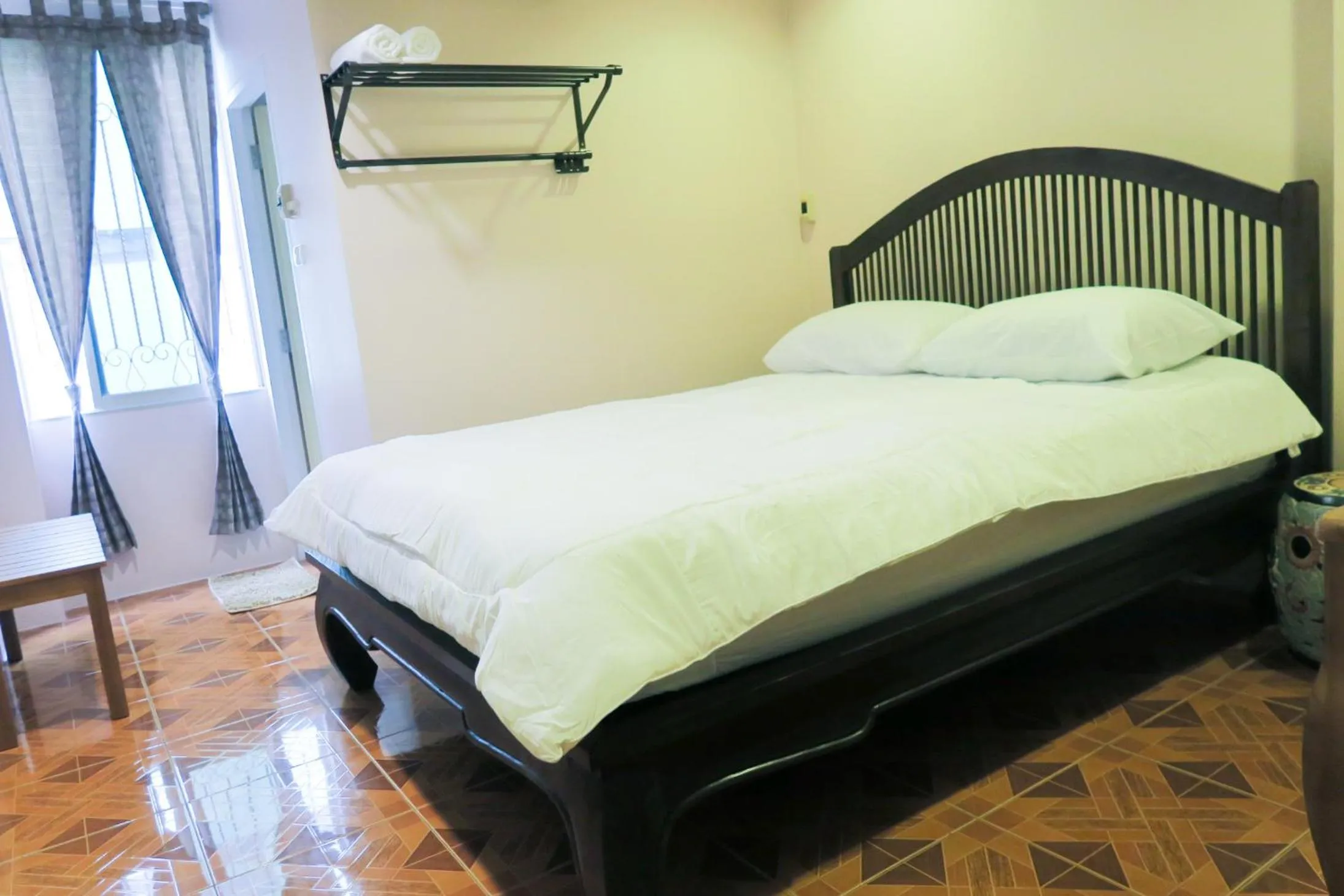 Bed in The Grand Palace Hotel