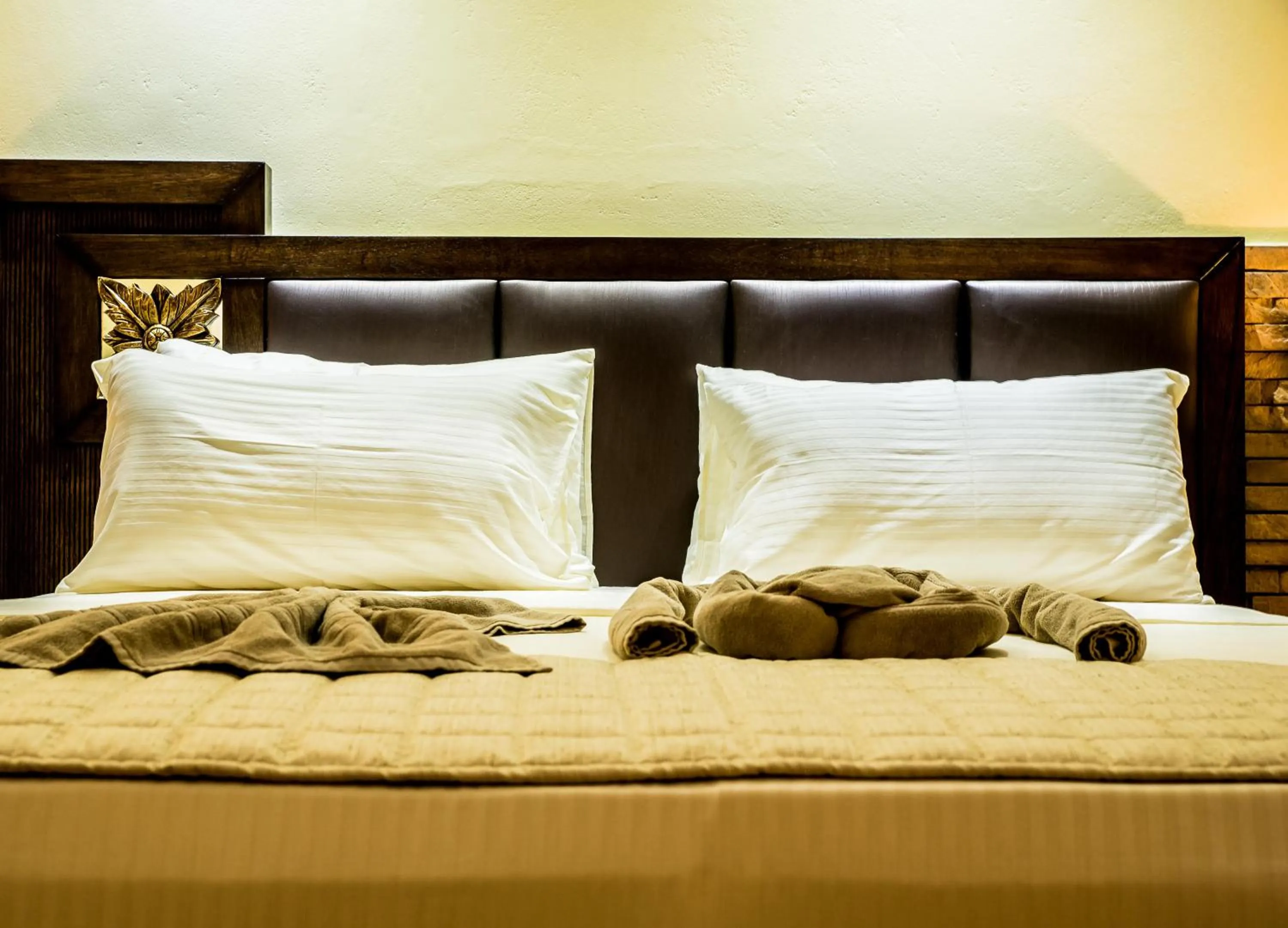 Bed in Oasis Hotel Restaurant & Spa