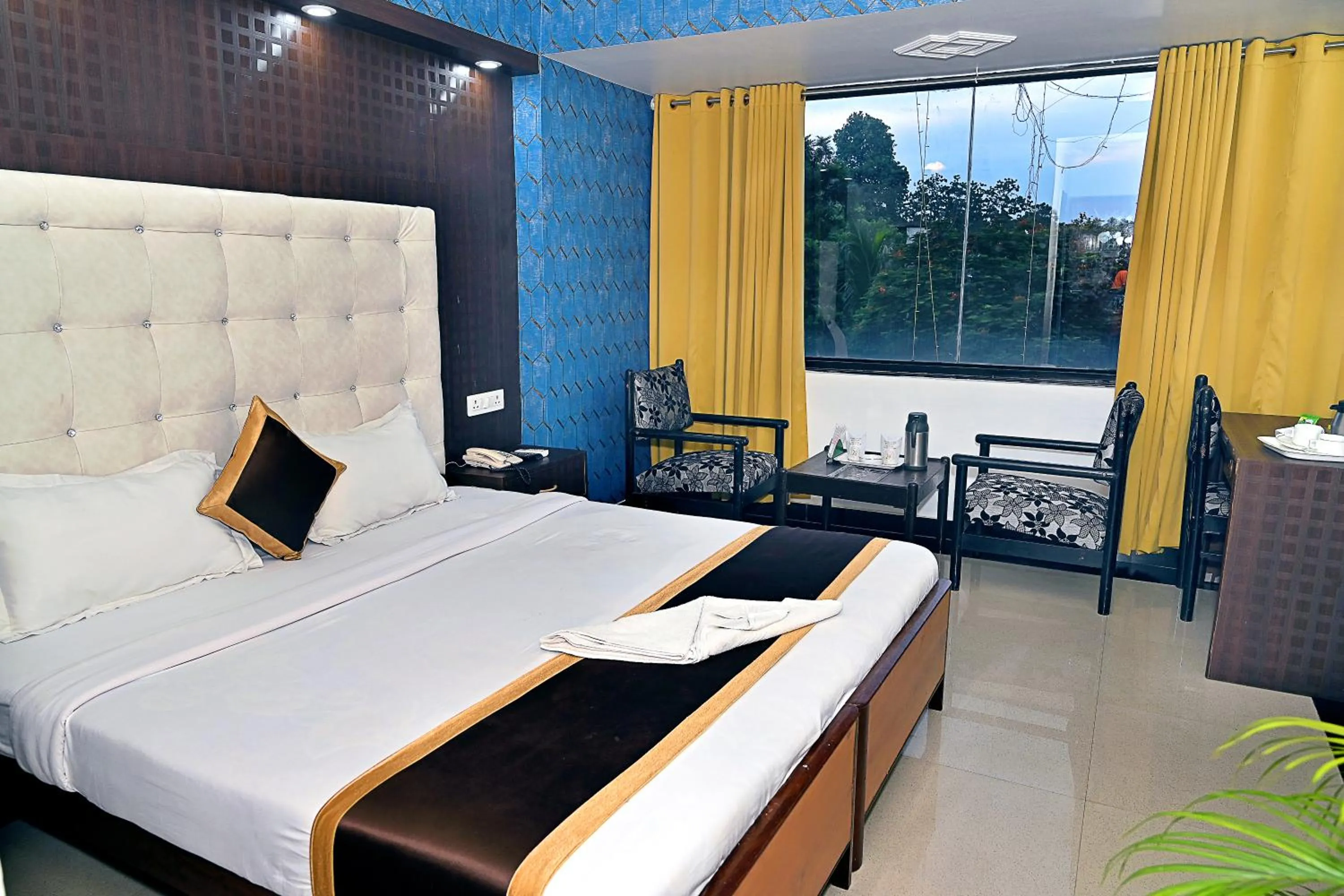 Bed in Hotel Rajhans International