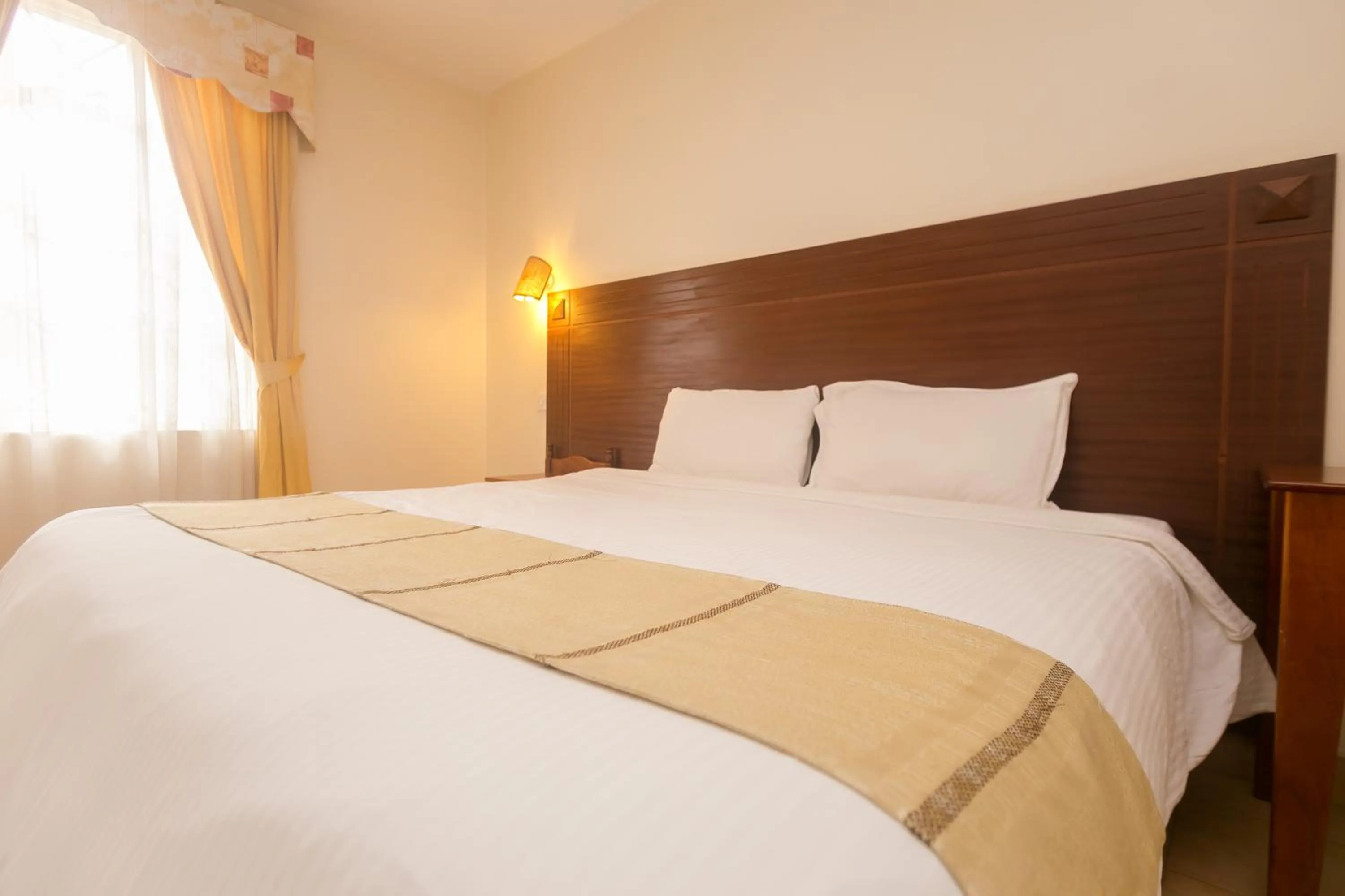 Bed in Corat Africa Hotel