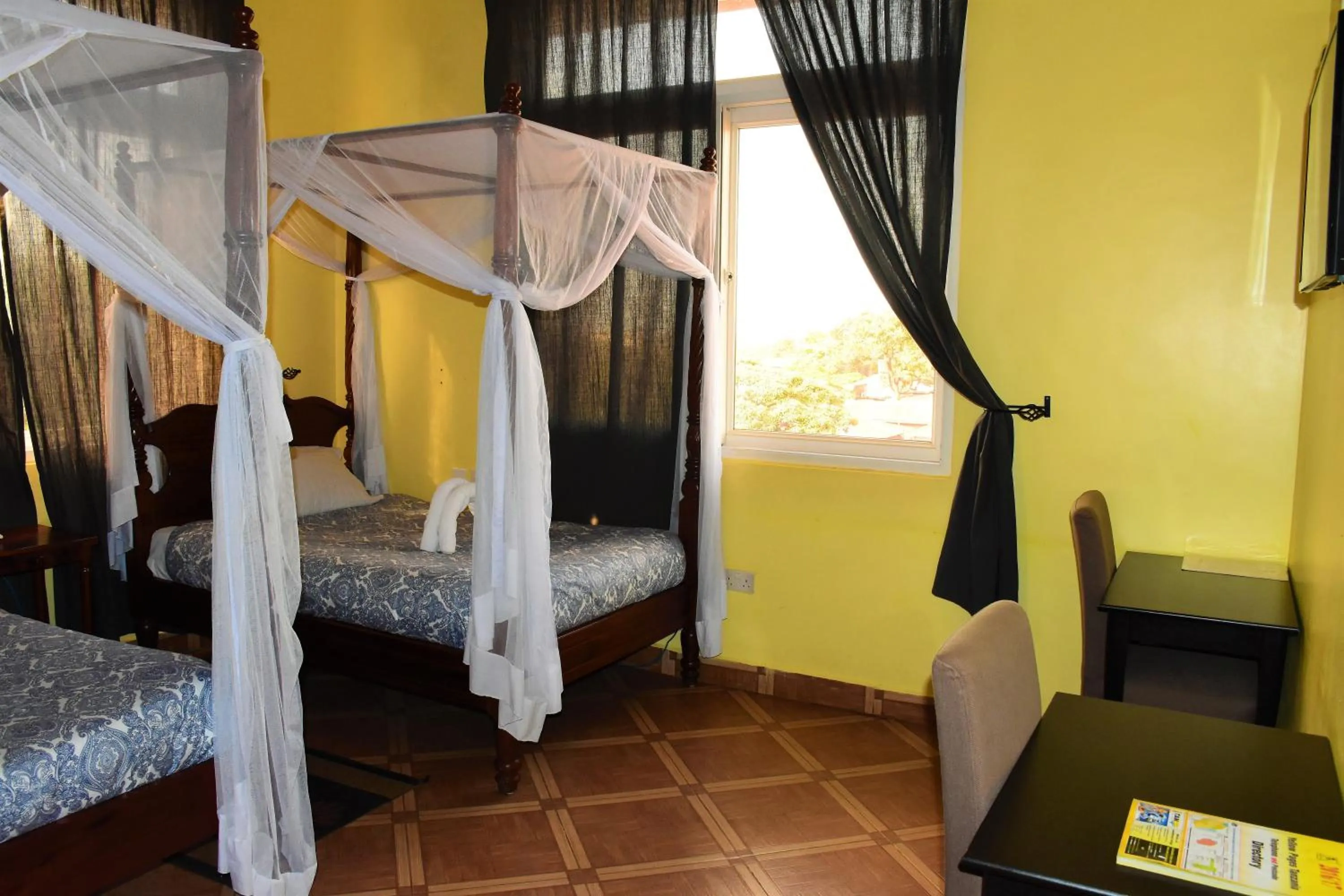 Bed in East Point Hotel Moshi