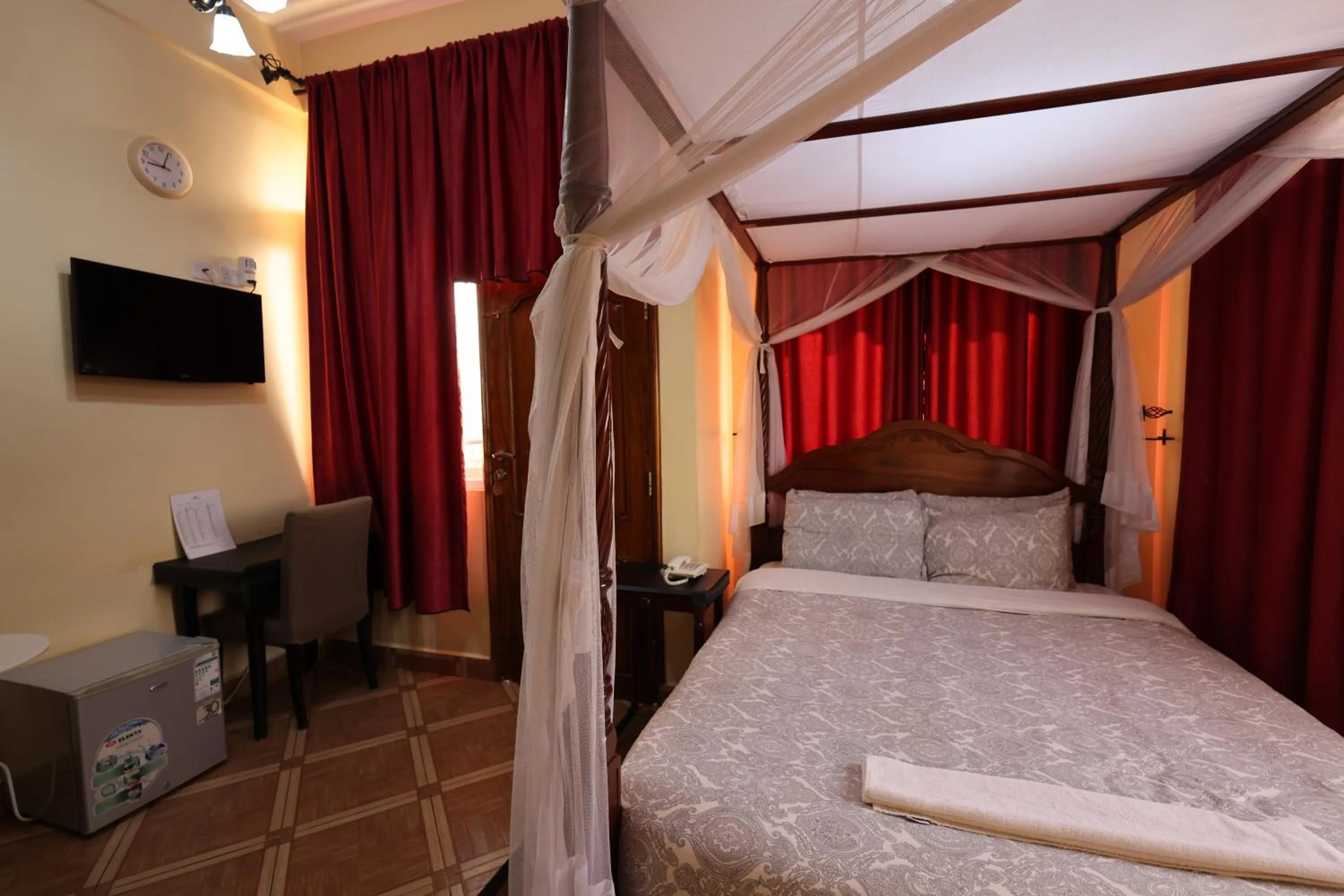 Bed in East Point Hotel Moshi