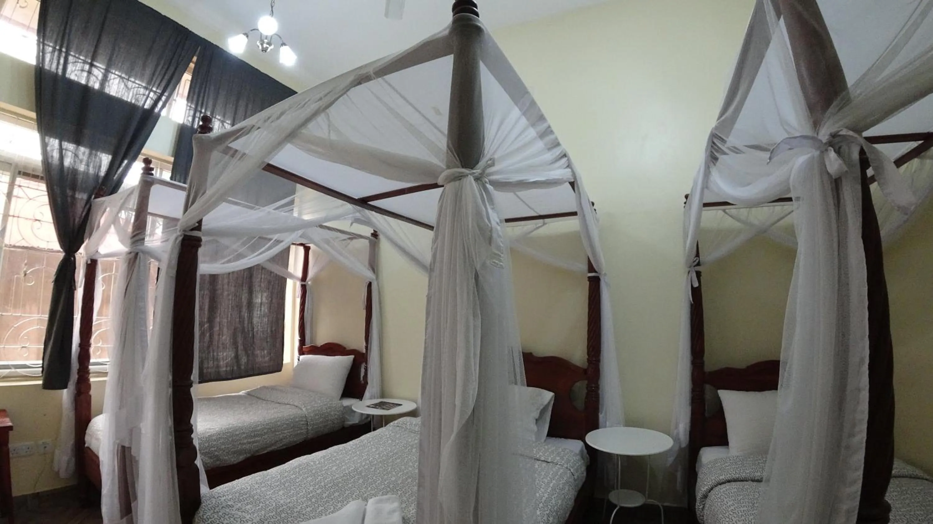 Bed in East Point Hotel Moshi