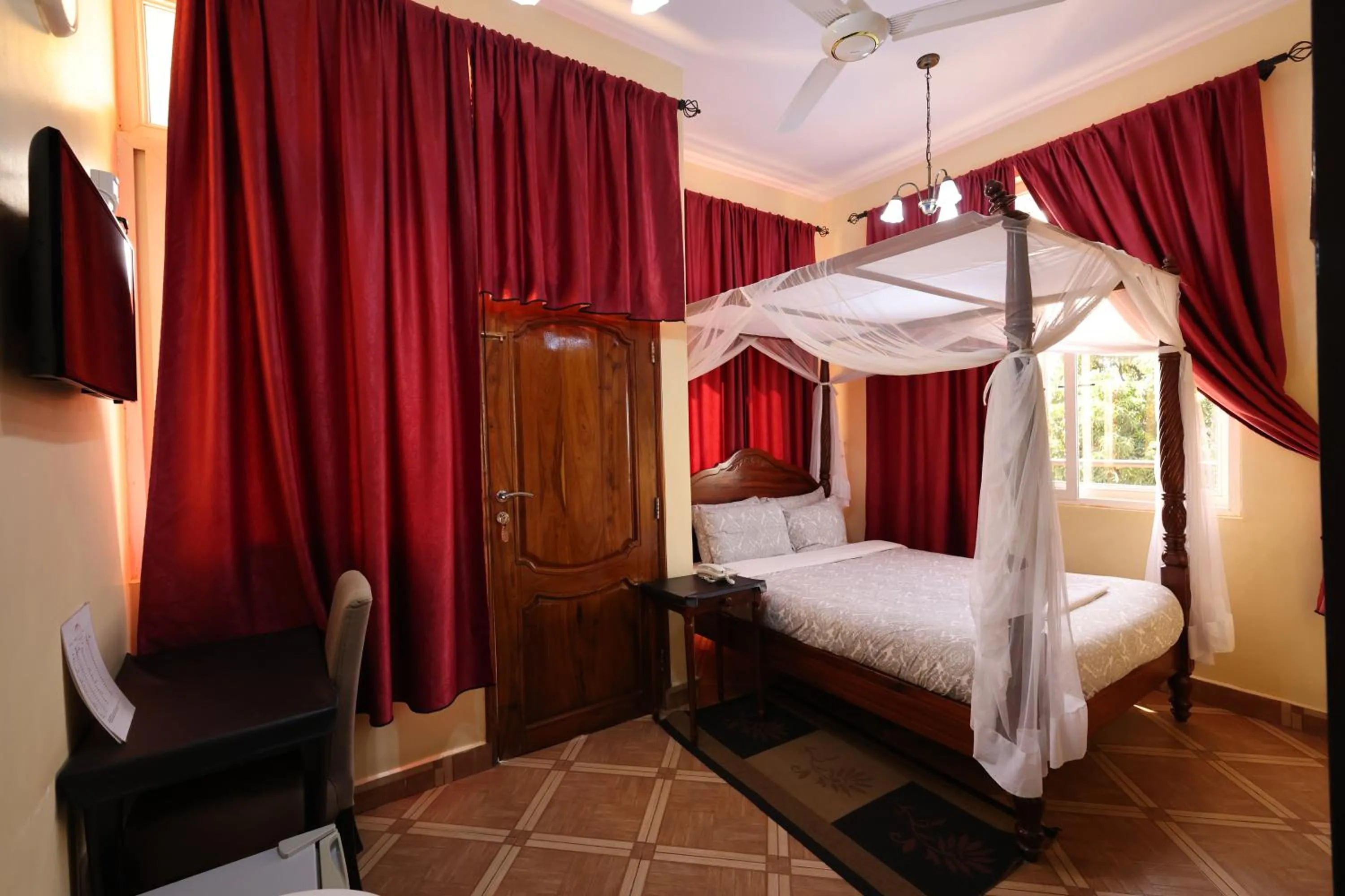 Bed in East Point Hotel Moshi