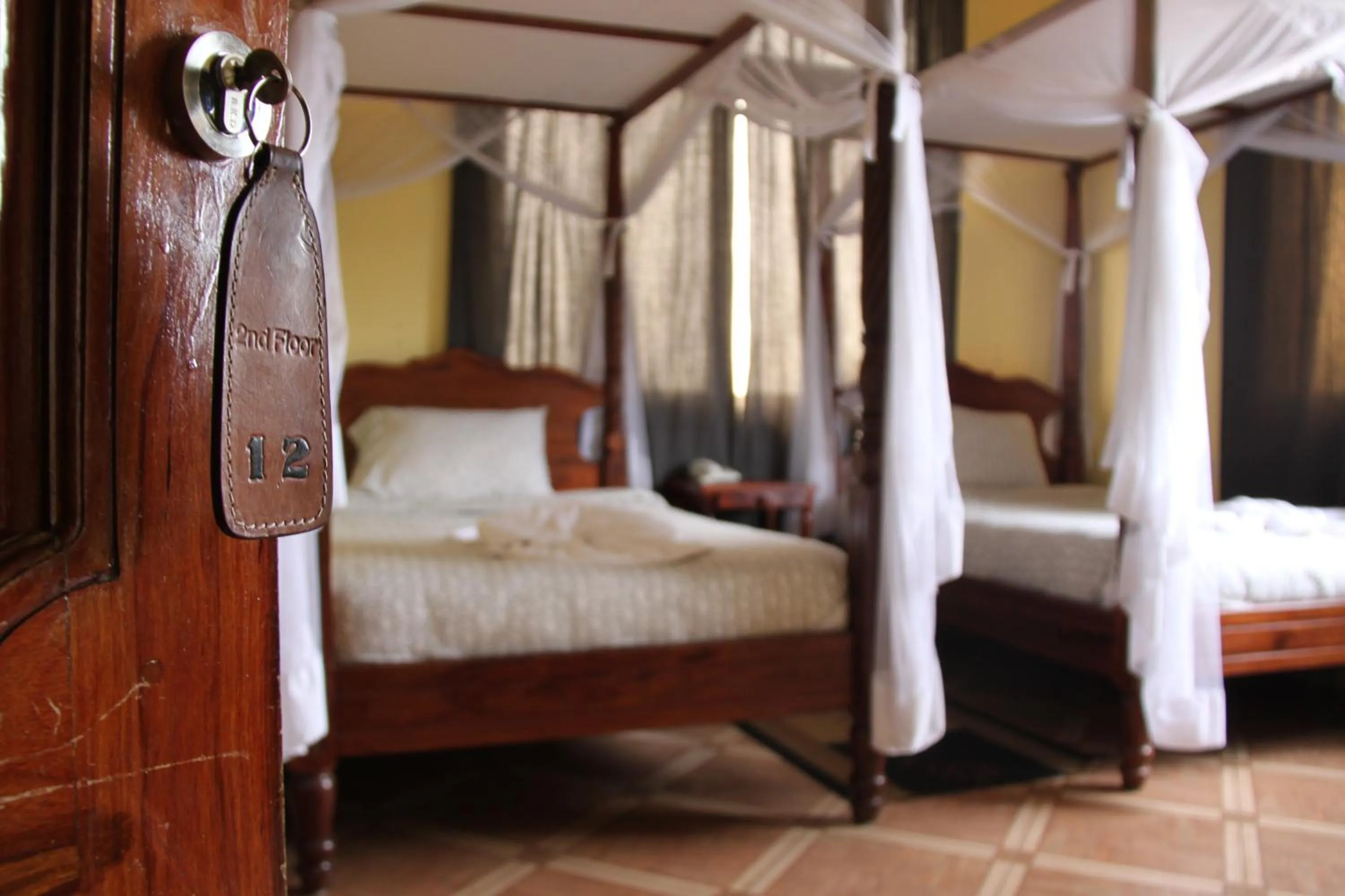 Bed in East Point Hotel Moshi