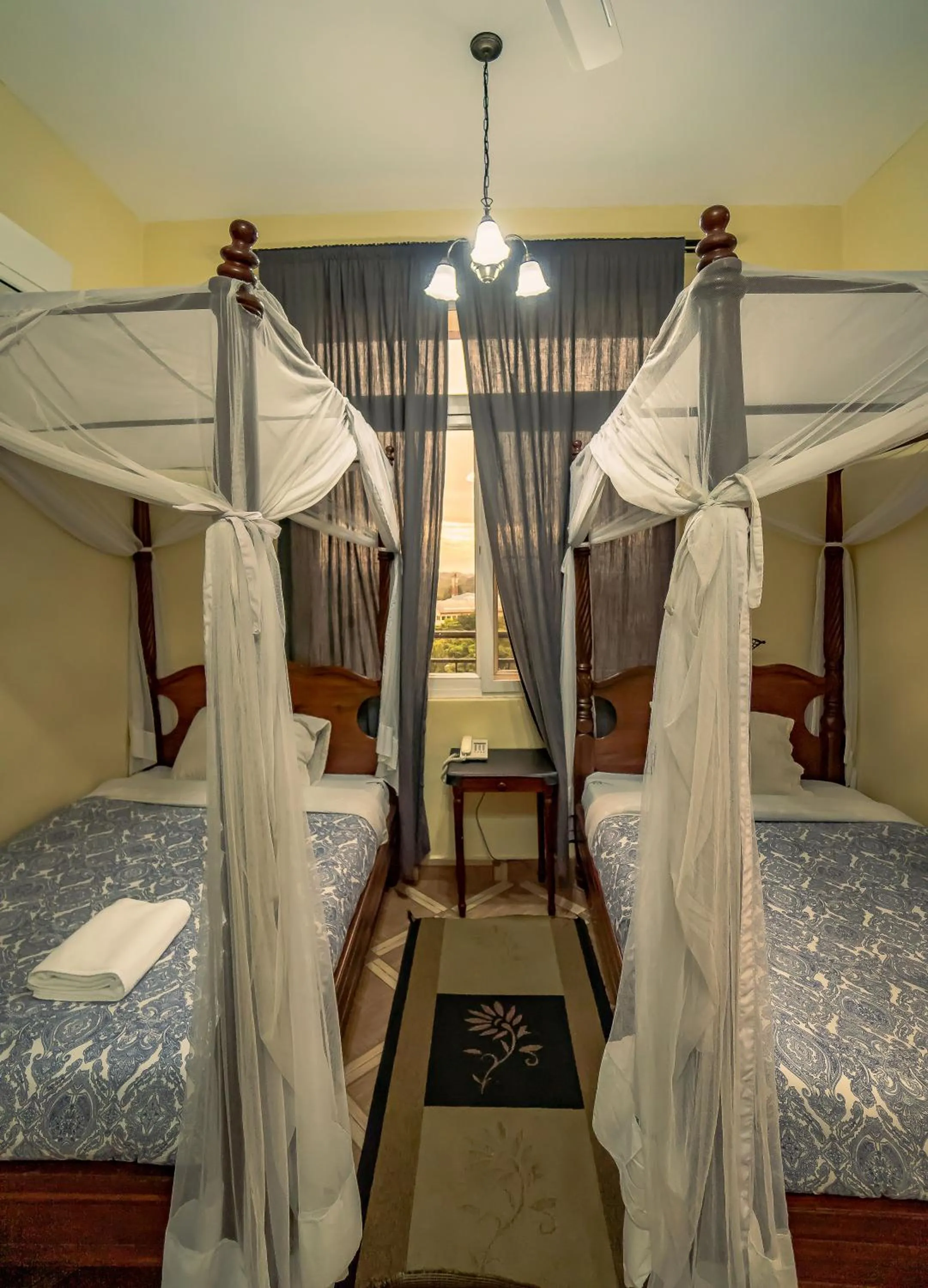 Bed in East Point Hotel Moshi