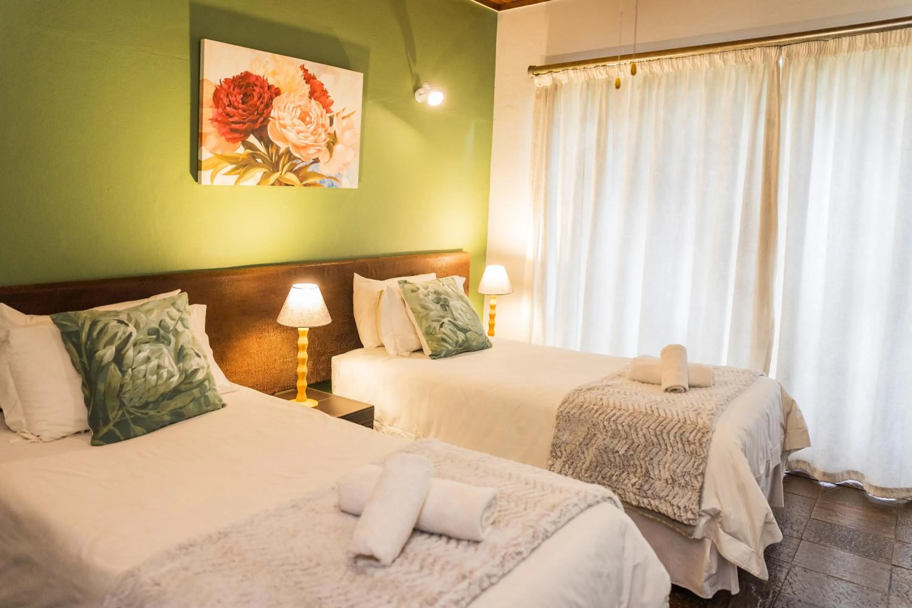 Bed in Rozendal Guest House