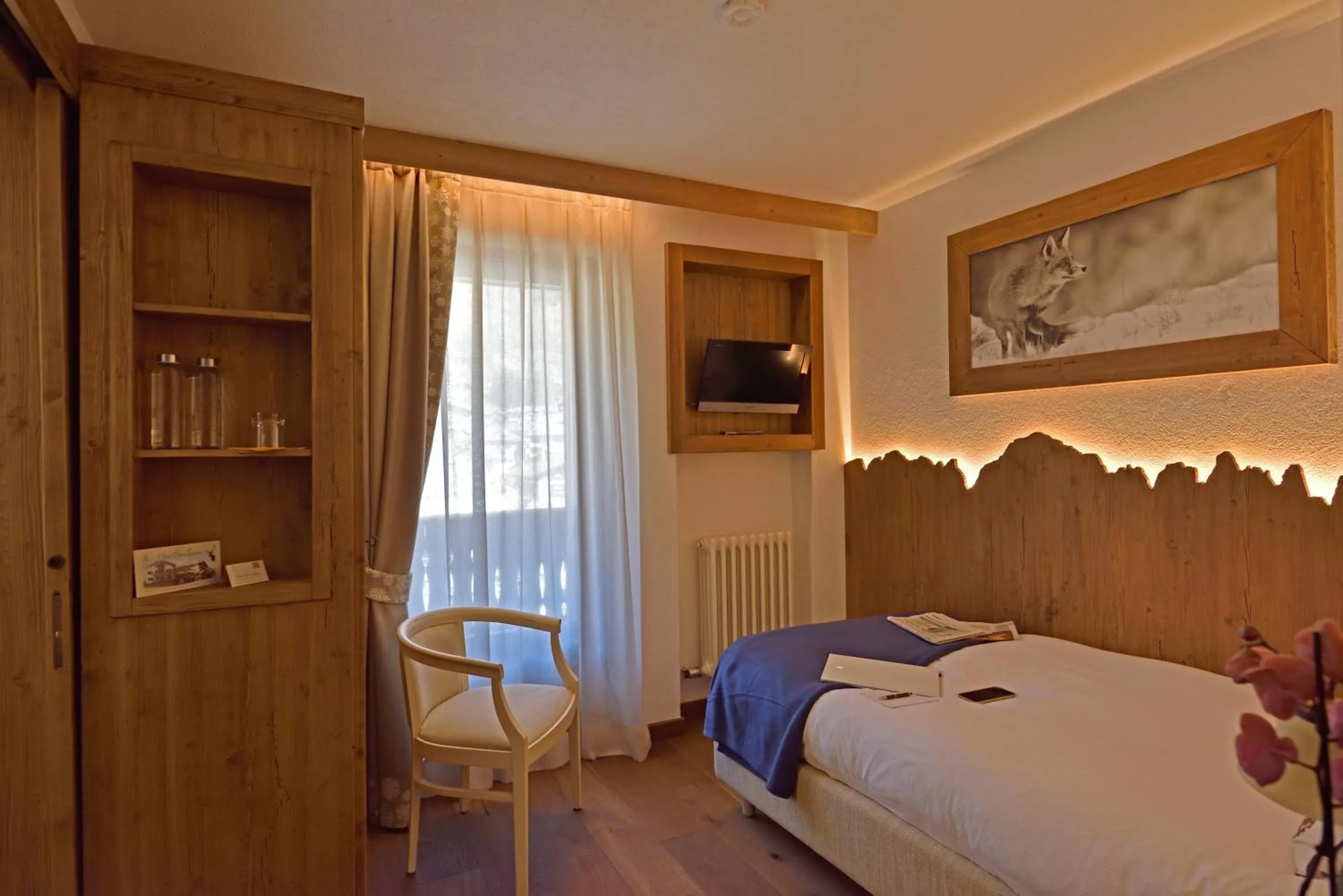 Bed in Hotel Beau Sejour