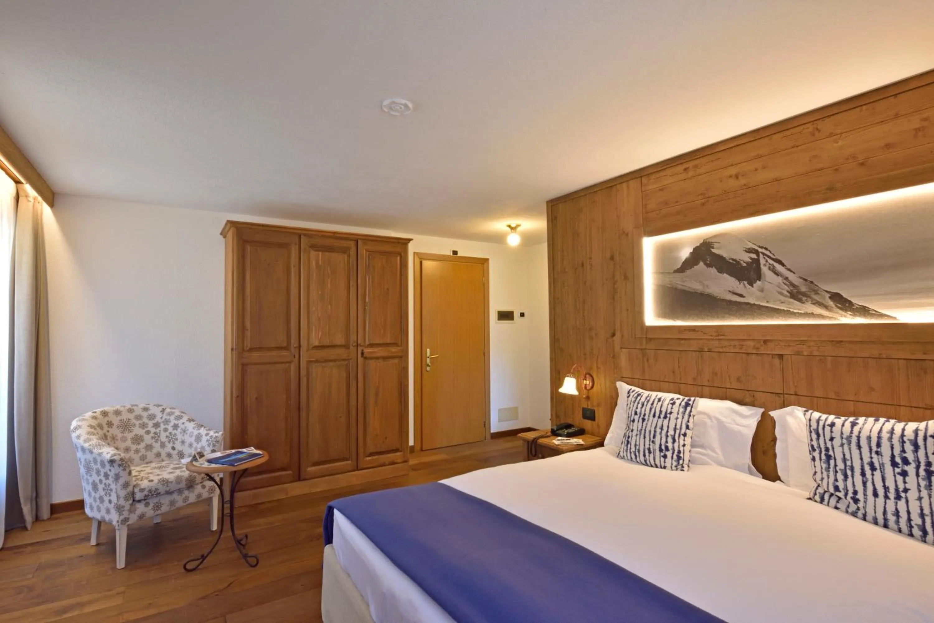 Bed in Hotel Beau Sejour