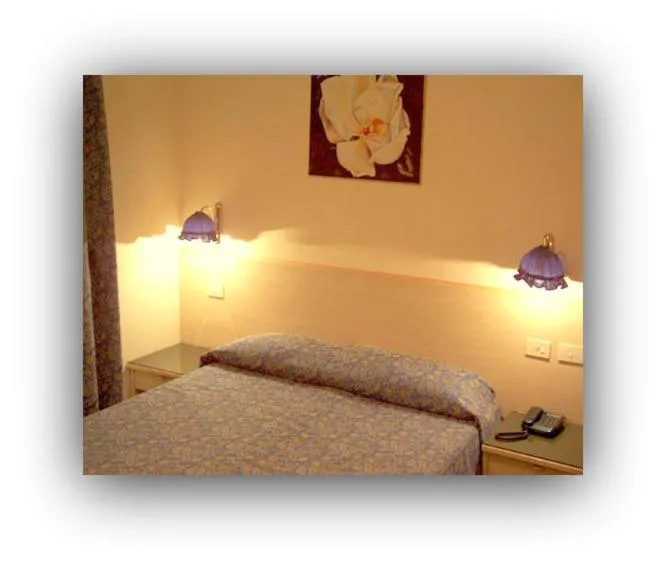 Bed in Hotel Beau Sejour