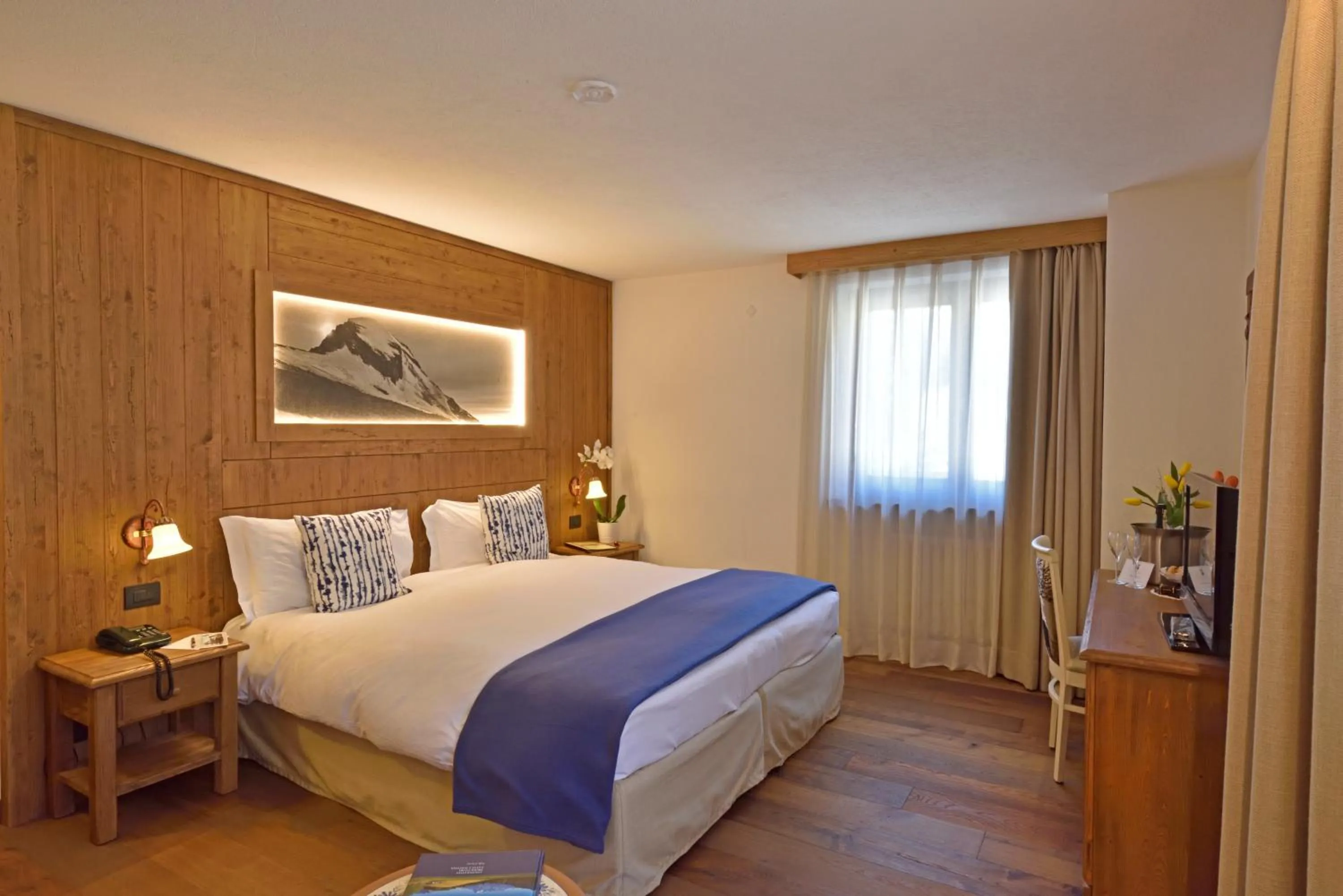 Bed in Hotel Beau Sejour