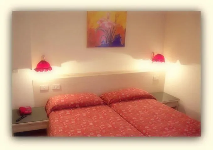 Bed in Hotel Beau Sejour