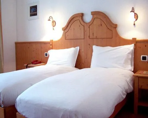 Bed in Hotel Beau Sejour