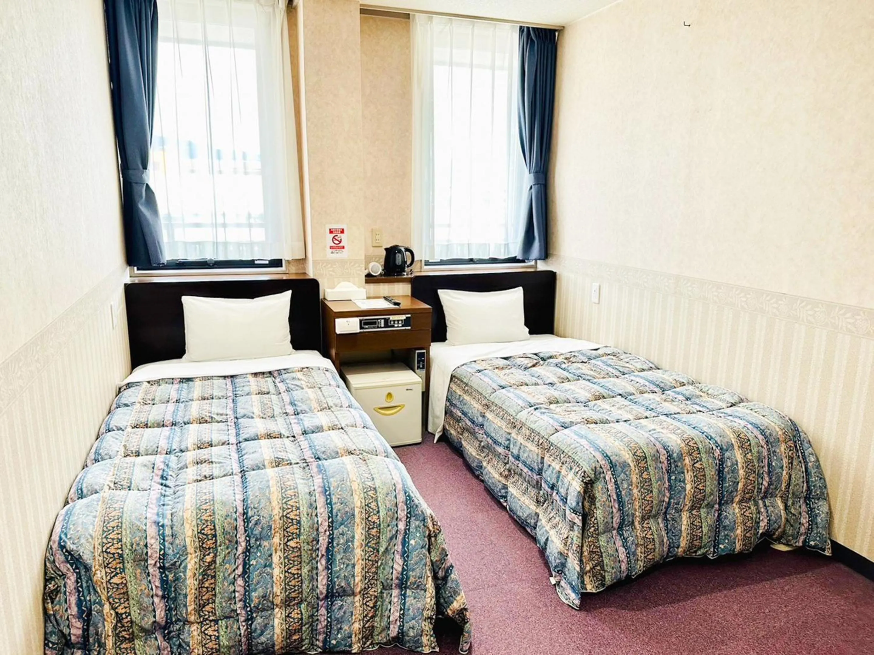 Photo of the whole room, Bed in Station Business Hotel Tenshukaku