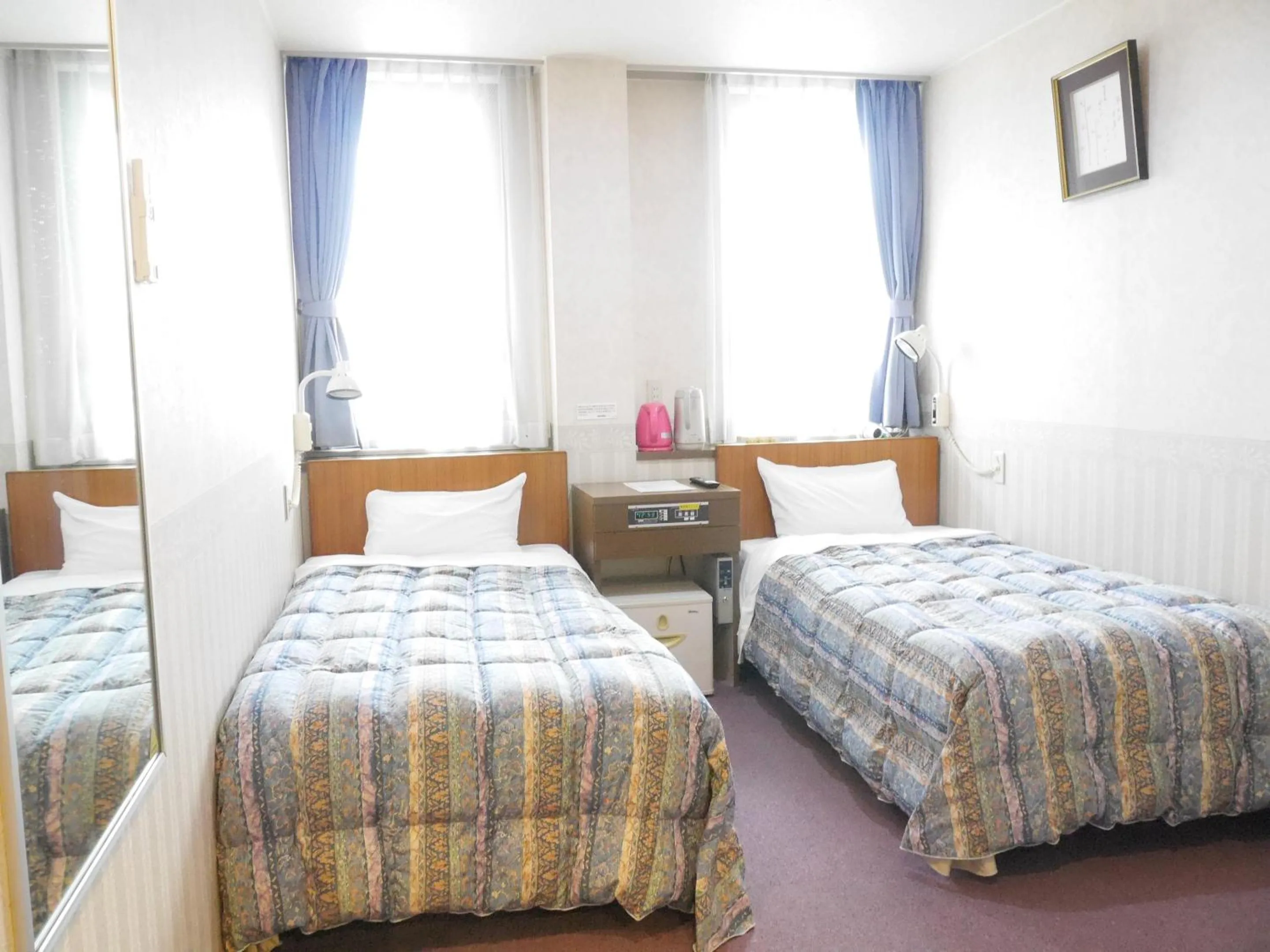 Bed in Station Business Hotel Tenshukaku