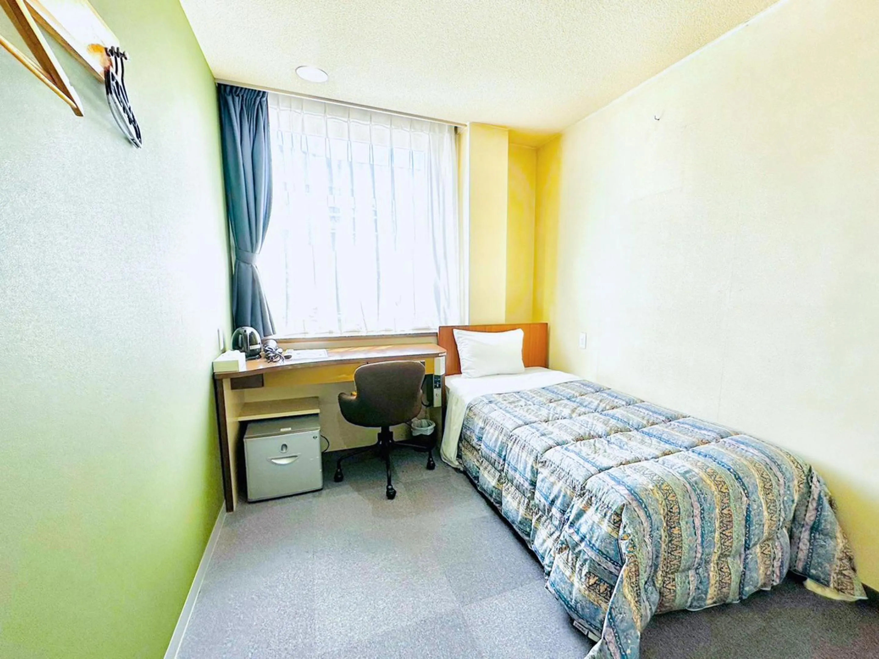 Photo of the whole room, Bed in Station Business Hotel Tenshukaku