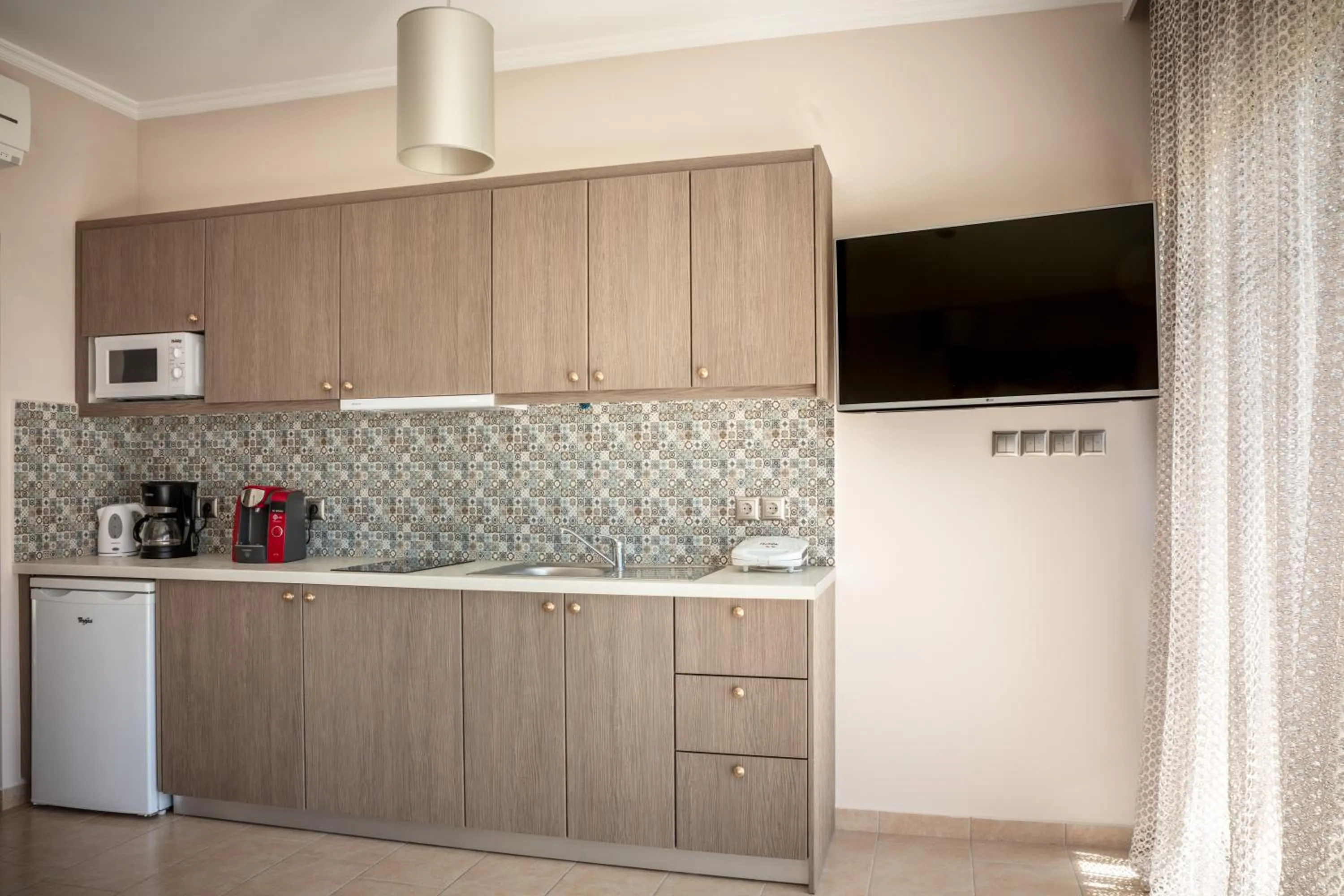 Kitchen or kitchenette in Royalty Suites Seaside