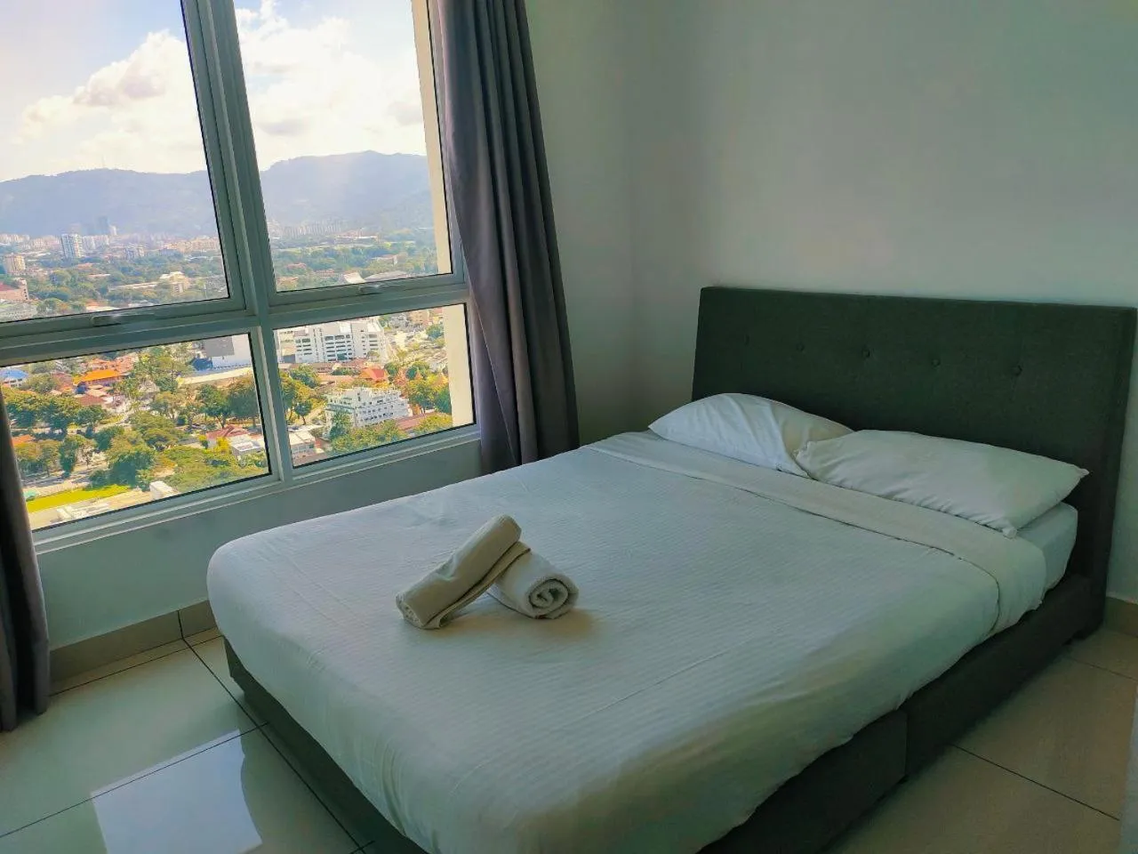 Bed in Merlene Suites at Mansion One Formerly know as Mansion One Suites